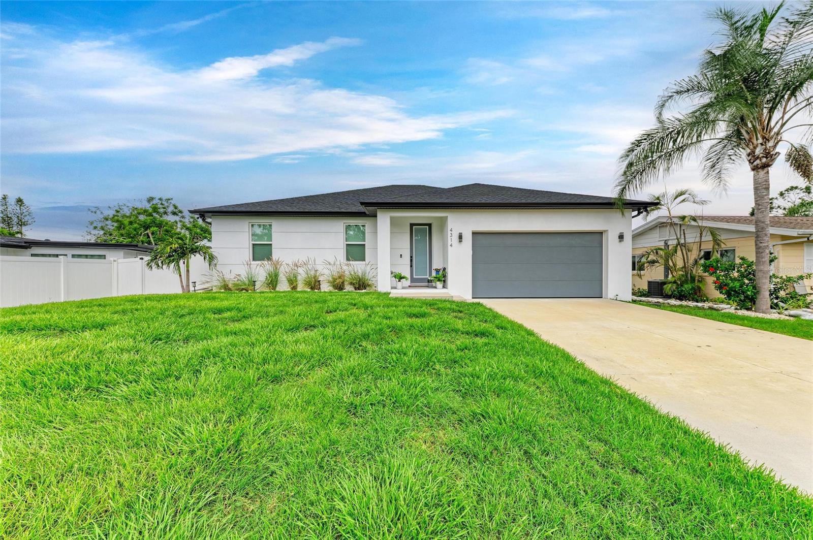 Enjoy the comfort and safety of a custom built, new construction home in the heart of Sarasota! This gorgeous 4 bedroom, 3 bath home has all the modern touches including hurricane impact windows and garage door, luxury vinyl plank flooring, high ceilings, and a fenced yard! The open floor plan and family room are perfect for entertaining, and the kitchen is a chef's dream with Cafe stainless steel appliances, quartz countertops with a large waterfall edge island, plenty of storage, shaker cabinets, and sliding doors to the patio. Great detail and mindful construction went into all aspects of this home including 2 owners suites, ceiling fans with lights throughout, drapes with rods and blinds, bathrooms with upgraded fixtures, showers, and quartz countertops. The home is built up to be 4 ft above the road and the AC unit is raised as well to help alleviate flood concerns and keep this home high and dry in the storm season. Not in a flood zone, no HOA, no deed restrictions- bring your boat and toys! High ceilings in the garage with room for additional shelving and insulated garage door! Just up the road from Legacy trail and Red Bug Slough. This home is conveniently located near shopping, restaurants, downtown Sarasota and St Armands Circle, SRQ Airport, Casey Key, Lakewood Ranch, and is a quick jaunt to the world famous beaches of Siesta Key!