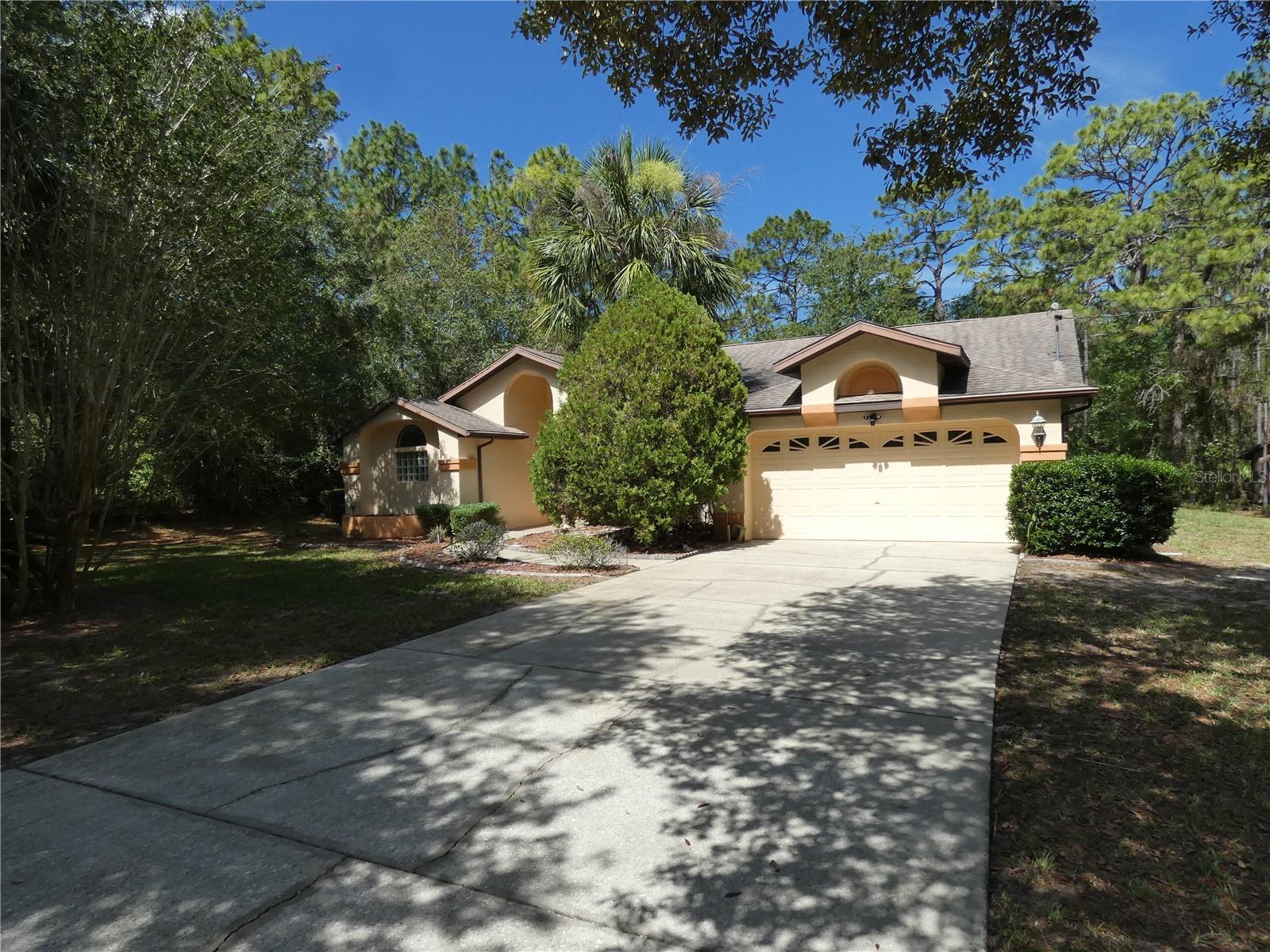 Welcome to your private retreat! This well-maintained 3-bedroom, 2-bathroom home features a spacious split floor plan and a fully screen-enclosed pool—perfect for relaxing or entertaining year-round. Nestled on over an acre of land, you'll enjoy both privacy and plenty of room to roam. Whether you're looking to unwind in your backyard oasis or host weekend gatherings, this property offers the best of Florida living.