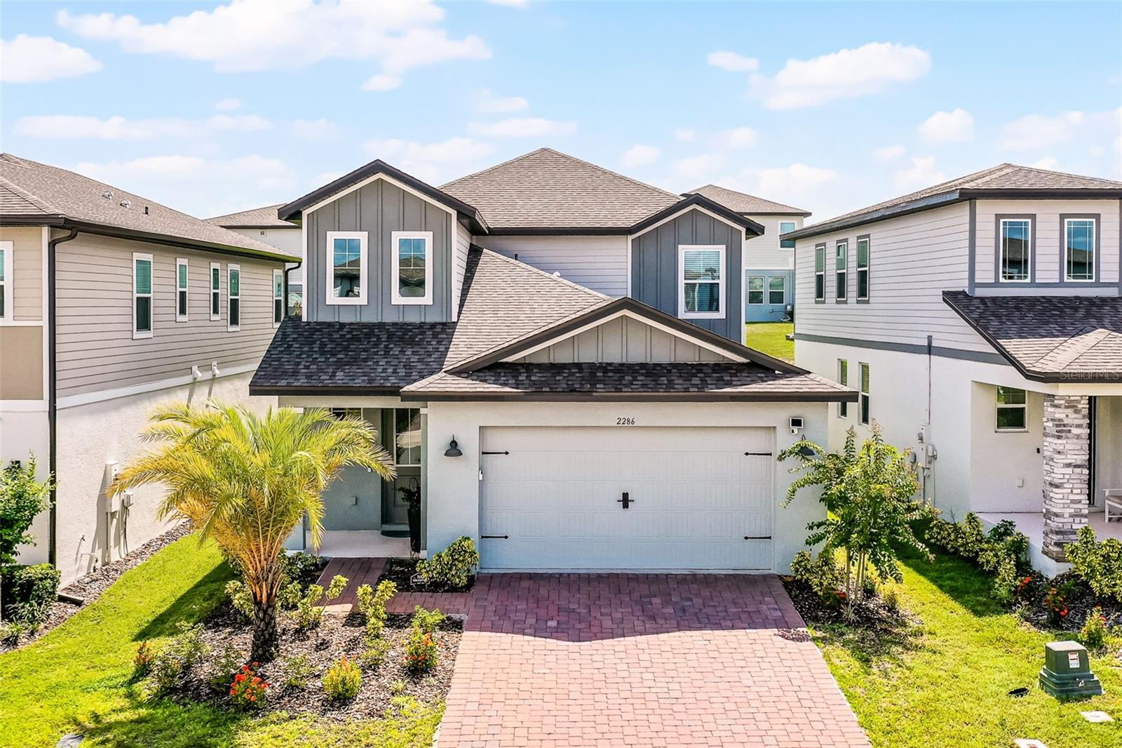 Nestled in the vibrant and rapidly growing hot spot of Minneola, this charming two-story home offers the perfect blend of comfort, convenience, and style. Thoughtfully designed with everyday living in mind, the primary bedroom is located on the first floor that flows seamlessly throughout the main living areas. The open-concept family room offers generous space to relax or entertain, with sliding glass doors that lead out to a covered lanai—perfect for soaking up the Florida sunshine. The kitchen is a true centerpiece, boasting stylish cabinetry, quartz countertops, and a striking backsplash with elegant contrasting accents, all tied together with sleek hardware. A cozy breakfast nook provides the perfect spot to start and end your day. Upstairs, a spacious loft/bonus room offers flexibility for a game room, home office, or additional living space, while three additional bedrooms and a well-appointed full bath with dual sinks make it ideal for family and guests. Located in a community with an abundance of amenities—including scenic green spaces, sidewalks, a community pool, playground, and more—this home invites you to enjoy all that Minneola's newest and most exciting area has to offer. Welcome Home!