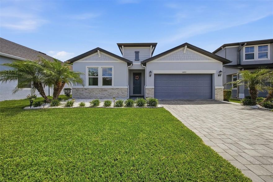 Move-in ready, meticulously maintained, and thoughtfully upgraded, this 4-bedroom, 3-bathroom home sits on a quiet cul-de-sac in the sought-after Watergrass community of Wesley Chapel, offering privacy, functionality, and serene pond views. Step inside to a bright, open concept layout enhanced by luxury vinyl flooring throughout the main living areas, creating a seamless and modern feel. The spacious kitchen serves as the centerpiece of the home, featuring ample cabinetry, pantry, generous quartz counter space, and a stylish backsplash that adds the perfect finishing touch. It flows effortlessly into the living and dining areas, with additional space for a formal dining area, playroom, or home office to fit your lifestyle needs. This home offers a versatile layout with generously sized bedrooms, including an additional bedroom with its own ensuite bathroom—perfect for guests or multi-generational living. The fourth bedroom also provides flexibility and can easily be used as a dedicated home office. The primary suite offers a relaxing retreat with a well appointed bathroom and a spacious walk-in closet. Step outside to your screened-in lanai and enjoy peaceful pond views with no rear neighbors directly behind. The backyard also offers plenty of room to add a pool, giving you the opportunity to create your own private outdoor oasis. Whether you're hosting gatherings or unwinding after a long day, this outdoor space delivers the best of Florida living. As a resident of WaterGrass, you’ll enjoy resort-style amenities including three community pools — a zero-entry pool currently being converted to a heated pool, a lap pool, and a traditional pool, plus a splash pad, tennis courts, coming-soon pickleball courts, clubhouse with fitness center, pavilion, dog park, and numerous parks, including one in Radley, making outdoor living truly effortless. Convenience is unmatched with I-75 just minutes away and everyday essentials like Publix, Starbucks, Chase bank, and professional offices just down the street. Top-rated schools, including Watergrass Elementary, Kirkland Ranch Academy of Innovation, and Innovation Preparatory Academy, are just moments away. The home’s prime location also offers easy access to Tampa Premium Outlets, The Shops at Wiregrass, KRATE at the Grove, top hospitals, and an array of dining and retail options. Don’t miss the opportunity to make it yours—schedule your private tour today!