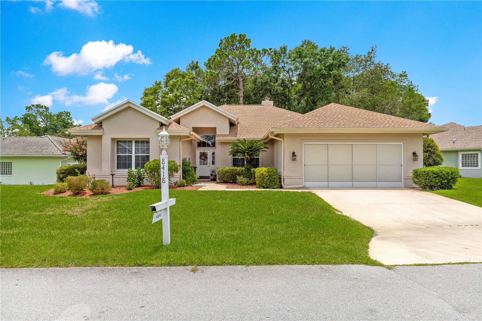 Welcome to this lovely Monte Carlo model on a PRIVATE home site! The attractive landscaping sets the stage for this home. Featuring tall ceilings, the living room is welcoming and warm. The double sided, wood burning fireplace would be the perfect location for holiday traditions. The guest bedrooms are set in a jack and jill configuration. The primary bedroom is huge with a large walk-in closet. the primary bath features a cultured marble shower, separate sinks and a deep cultured marble tub. The kitchen is perfectly suited for those cooking for a large party with tons of cabinets and counterspace. The large island in the kitchen is great at a buffet server or for your morning coffee. Updated stainless steel appliances and a built in pantry add to the many pluses in the home. The laundry room has built in cabinets and the washer and dryer are also included. The half bath is conveniently located off the kitchen. There is even room for a workbench and a 10x10 area in the garage with pull down stairs for storage. The 32x11 Florida Room that is under heat and air is the perfect space to bring the indoors and outdoors together and enjoy the private views this homesite has to offer. With a 2015 AC and 2022 roof this home is ready for it's new owners. Schedule your private tour today!
