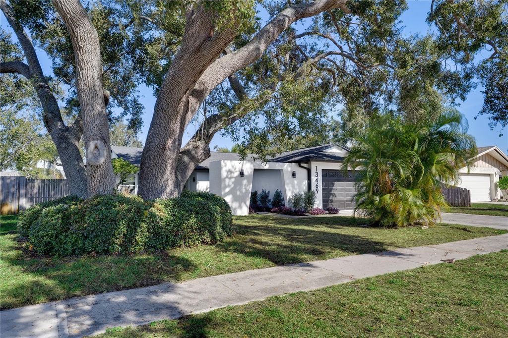 Photo of 13469 Sol Vista Dr, Largo, FL 33774 (MLS # TB8490126)