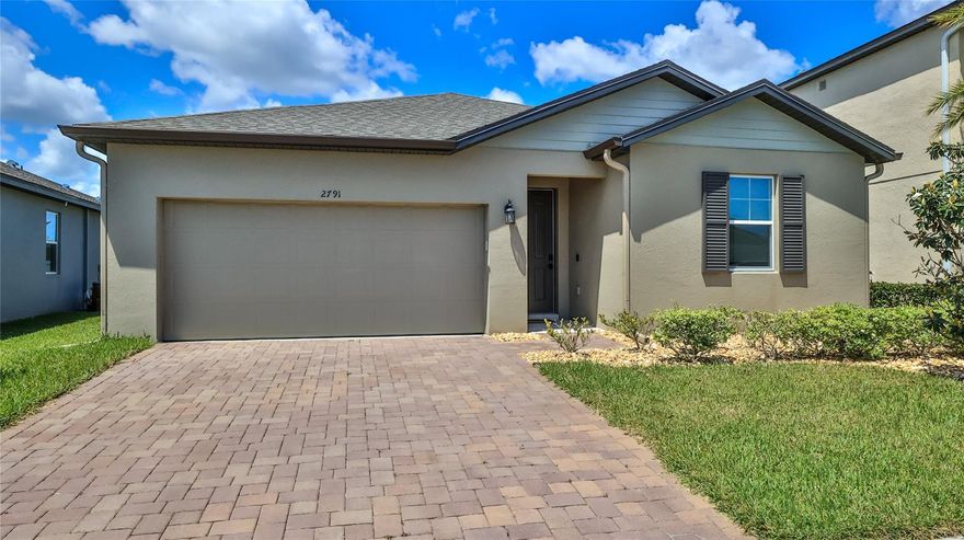 Why wait when you can buy nearly new and move in quickly! This spacious 4 bedroom, 2 bath home is only two and a half years new. The recently installed luxury vinyl flooring welcomes you at the entry and extends all the way through the living areas and master bedroom. The generous master is at the back of the home and has attached bath with large shower, double vanities, walk in closet and separate 'water closet'. The living spaces have open sight lines with high ceilings and lots of natural light. The kitchen has plenty of prep space, granite counters, stainless appliances and island seating. There are three additional bedrooms, each with a spacious closet, and a well appointed guest bath. A two car garage, covered back patio and great yard complete the package. The community pool and amenity center is a short walk or bike ride away and the neighborhood is close to all New Smyrna Beach has to offer. Home warranty included. Come see this one before it is gone! ;Water: City