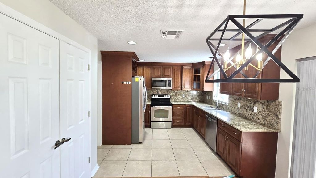 Photo of 12320 Bronson Way, Orlando, FL 32824 (MLS # S5140414)