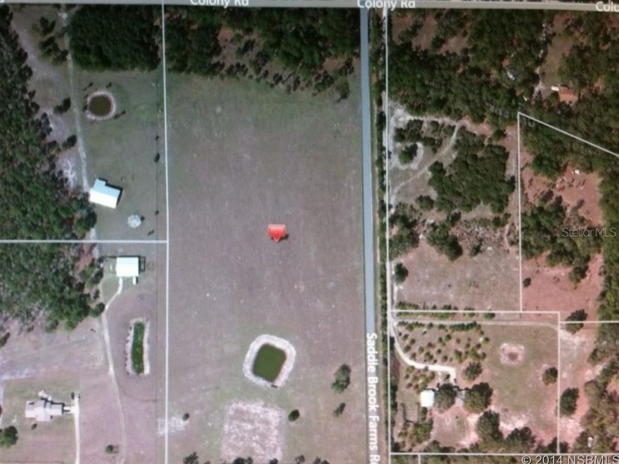 This property features a small pond, a brook running in front of the property, a house pad approximately 200 x 200 and a 142' deep well. It is completely fenced with four board and 4" cage wire inside the boards. Quite and serene this property is set back a few acres for privacy off of a paved road. Most of the land has been cleared. It's an animal lover's paradise.  Corner lot - fronts on Colony and the side by Saddle Brooks Farms Rd.