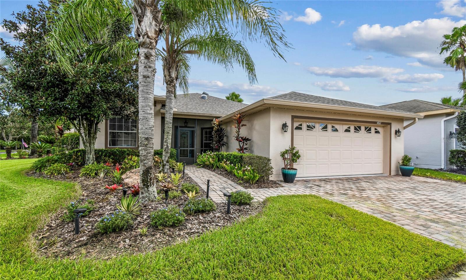 Beautiful Melody Model with 3 Bedrooms, 2 Baths and Stunning Water Views! Situated on a corner lot and adjacent to a beautiful park-like setting with space for recreation or leisurely walks. Step into this immaculately maintained home showcasing upgrades throughout, including CROWN MOLDING, wide-plank LVP flooring in all bedrooms, and newer interior paint. A NEW ROOF was installed in 2021 with an attic ventilation system. HVAC 2020. HYBRID HOT WATER HEATER installed in 2020. The kitchen boasts solid wood cabinets, stainless steel appliances, GRANITE COUNTERS with mosaic stone backsplash, under-cabinet lighting, and a separate eat-in nook, currently being used as an office space. The living room features two SOLAR TUBES that fill the space with natural light and flows seamlessly to the porcelain-tiled, glass-enclosed Florida room. The OWNER'S SUITE offers sliders to the Florida room and an attached ensuite bath with DUAL SINKS, a walk-in shower, and two walk-in closets with custom shelving. Two additional bedrooms on the opposite side share a Jack-and-Jill bathroom featuring a tiled glass walk-in shower and granite counters. In addition to the Florida room, there is a SCREENED and EXTENDED lanai where you can enjoy stunning water views or relax and take in quiet sunrise mornings. String lights create a relaxing atmosphere where you can unwind at night with a glass of wine while enjoying the shimmering pond views.The garage features EPOXY FLOORING, built-in shelving for extra storage, a work bench, painted walls, a NEW GARAGE DOOR MOTOR with new door springs installed in 2024. Additional upgrades include permanent seasonal and year-round Govee exterior lighting, refreshed landscaping with rock and lighting added in 2024, resurfaced lanai floors with additional drains, and ceiling fans in every room. A separate laundry room includes a UTILITY SINK, cabinets, and the washer and dryer are included in the sale. EXTERIOR PAINTED in 2020. **See the MATTER PORT 3D VIDEO on Tour Link 1. Solivita's amenities include: - a manicured SOFTBALL diamond & field - 36 holes of CHAMPIONSHIP GOLF that can be played by joining the Stonegate Golf Club or paying as you go - 2 STATE of the Art AMENITY centers with updated exercise equipment, yoga studio & meeting rooms - 3 restaurants - 14 HEATED POOLS - 17 PICKLEBALL courts - 9 TENNIS courts - 4 BOCCE BALL courts - 4 SHUFFLEBOARD courts - 3 HORSESHOE pits - a BILLIARDS room - miles of bike paths - 2 DOG PARKS (Small & Large Dogs) - Corn Hole - Tot Lot PLAYGROUND - COMMUNITY GARDEN - over 250 resident clubs. The HOA: - maintains the LANDSCAPING & IRRIGATION systems in the common areas as well as at individual homesites - maintains the roads throughout the community - PROVIDES SECURITY with gate guards and mobile patrols including the Polk County Sheriff - allows AUTOMATED GATE ACCESS for residents via license plate readers - provides residents with Fiber Optic Internet & TV service.***Poinciana Lakes Plaza is a MAJOR NEW SHOPPING CENTER that opened directly across from the Solivita Main Gate in Summer of 2024. It features Sprouts Grocery, TJ MAXX, Ross, Burlington, Rack Room Shoes, 5 Below, Ulta, Outback, First Watch, 5 Guys, Urgent Care, Dentist, TD Bank, Petco & Hair Cuttery PLUS MORE TO COME.***