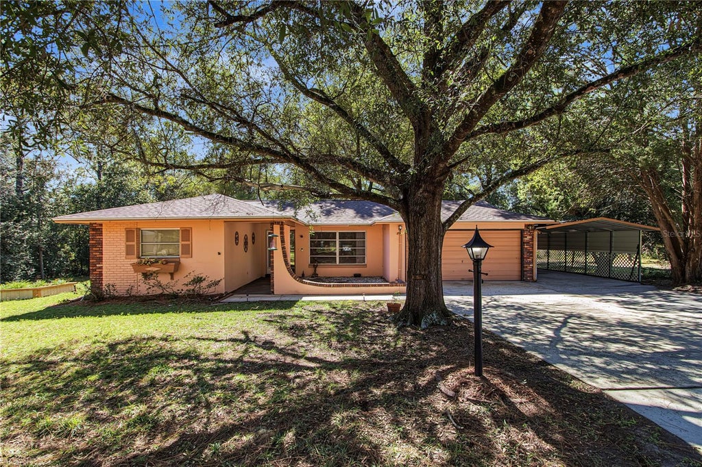 Photo of 1414 W Evergreen Drive, Citrus Springs, FL 34434 (MLS # OM734746)