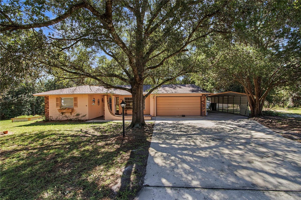 Photo of 1414 W Evergreen Drive, Citrus Springs, FL 34434 (MLS # OM734746)