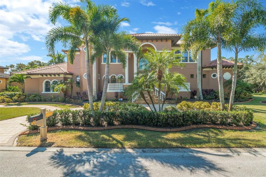 Custom built Mediterranean home with no detail missed in this well thought out design. Lavishly appointed, this elegant home offers four bedroom suites, four full plus two half-baths, game room with wet bar, an office and a three car-garage. The gourmet eat-in kitchen overlooks the family room and features a chef-friendly island, top-of-the-line appliances and granite counters. Soaring ceilings, decorative moldings, two fireplaces and a dramatic, floating staircase are just a few of the amenities. The split bedroom plan includes spacious rooms with large walk-in closets and private baths. Just off the executive office, the master suite with sitting area boasts an incredible master bath with granite floors, glass tile shower, a luxurious hydro/jetted spa,and HUGE walk-in California closet. Entertain poolside at the resort style backyard with full outdoor kitchen! This tropical oasis includes a refreshing pool with remote controlled rock waterfall, full outdoor kitchen, an abundance of lanai space for lounging with surround sound. Sitting on an over-sized 1/2 acre+ fenced lot, this home is conveniently located walking distance  from the local beaches and schools. Never flooded, built high and dry and includes a full house generator!