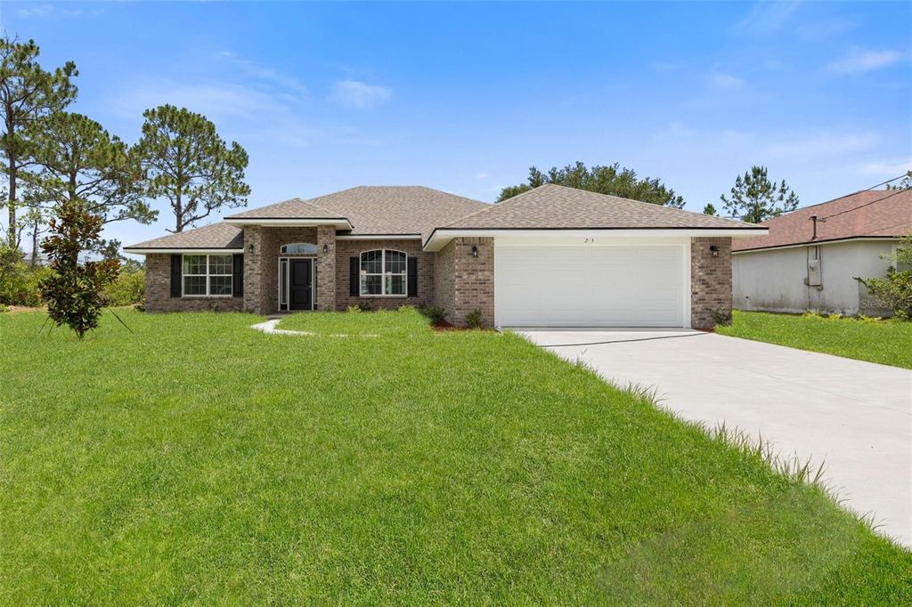 Photo of 128 Bird Of Paradise Drive, Palm Coast, FL 32137 (MLS # FC314811)