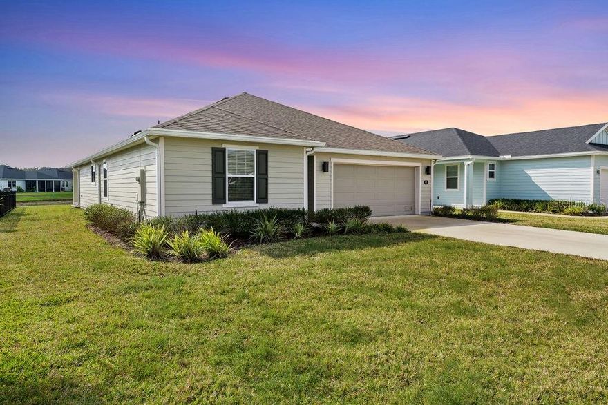 SUNRISE/ SUNSET- LIVE YOUR BEST LIFE YET!  AFFORDABLE BEACHSIDE LUXURY can be yours in this nearly new home in the sought-after community of Matanzas Shores – Las Casitas which offers the rare combination of modern design, serene waterfront living, and the ease of the Florida lifestyle—all just a few moments' walk from the Atlantic Ocean and the Intercoastal Waterway. This CASUALLY ELEGANT RETREAT was built only three years ago and has never been lived in. 45 LAS CASITAS BLVD. welcomes you with an effortless sense of calm. Step inside and you’re greeted by sunlight streaming through wide windows, creating a soft, airy glow that fills the open-concept layout. Every detail has been thoughtfully designed—from the elegant tile flooring that flows throughout, to the tasteful finishes that blend contemporary style with coastal charm. At the front of the home secondary guest bedrooms and a full bath offer comfort and PRIVACY for family or visiting friends. Follow the wide hallway and you’ll find yourself in the heart of the home—a bright, open living space overlooking the tranquil waters of a small lake. The kitchen is both refined and functional, featuring granite countertops, an oversized island, and stainless-steel appliances—the perfect centerpiece for cooking, entertaining, or unwinding over a glass of wine. The GREAT ROOM concept of connected dining and living areas invite easy connection, with sliding glass doors that open to peaceful water views and gentle coastal breezes. The owner’s suite is a true retreat, framed by picture-perfect windows and enhanced by a stylish tray ceiling. Wake up to SPECTACULAR SUNRISE VIEWS and step into your en-suite bath, where dual granite vanities, a glass-enclosed walk-in shower, and a spacious closet make everyday routines feel like a spa experience. Outdoors, your covered patio features durable epoxy flooring—a wonderful spot to enjoy your morning coffee or admire the SUNSET VIEWS reflected on the water. The large, level backyard offers plenty of space for a future pool or garden, completing this picture of relaxed, refined living. The Las Casitas community takes the Florida dream one step further- FEATURING WORLD CLASS RESORT STYLE AMENITIES...Enjoy private beach and Intracoastal access, two clubhouses with fitness centers, sparkling pools,  tennis and pickleball courts, shuffleboard, walking and biking trails, nature preserve, boat club and kayak launch, ETC.—all just moments from home. It’s a neighborhood designed for connection, leisure, and coastal adventure. Blending the sophistication of new-construction design with the heart of a true beachside escape, this home is proof that luxury and livability can coexist beautifully. Don’t miss your chance to claim this stunning waterfront haven—schedule your private tour today and discover life where every day feels like a getaway. WHAT ARE YOU WAITING FOR? Live YOUR DREAM- BUY THE BEACH HOUSE!