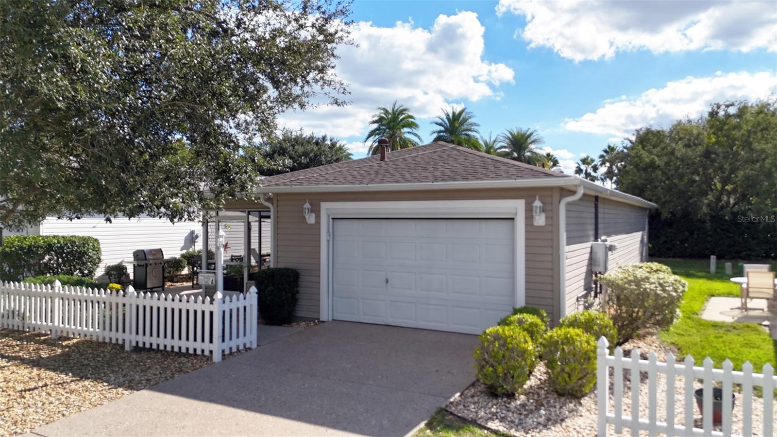 If you are looking for the best patio villa located in the best location, your search stops NOW! This extremely updated villa is located in Hickory Grove Villas in the Village of Sunset Pointe, smack dab in that middle point between Rt 466 and Rt 466A. Take your golf cart for a quick ride to Lake Sumter Landing or head south to Brownwood. You’re in the middle of everything!
Now that we have the location figured out, let’s take a look at what makes this house so special. How about NO backyard neighbors, cross the street to Cane Garden Country Club, and a painted and textured driveway? Check out the all new (2025) HVAC unit, tankless hot water heater (2025) and that epoxy garage floor? You’ll be happy to see it also has a new (2025) Nova water filtration system also!!
Moving to the inside of the house, ther is NO CARPET, just tile and LVP flooring throught the house. The kitchen and bathrooms feature granite counters and a matching granite backsplash in the kitchen. There are three solar tubes to brighten up the kitchen and baths, and wait until you see the totally remodeled and updated Master Bath! You haven’t seen a patio villa bath like this one before!
Don’t worry about appliances breaking down because there is a new LG brand washer, dryer and refrigerator waiting for you!
The front patio features tile flooring and the only grass is a small area in the back yard you can easily take care of. The front and side features a very innovative rockscape design!
If you’re not convinced yet that this is the Patio Villa for you, it also includes furnishings for the living room and dining room! That includes a quality leather sofa and loveseat and a TV complete with a useful wall unit! Start enjoying your home immediately!
Make it a point to check out this great property in a fabulous location TODAY! You’ll be glad you did!