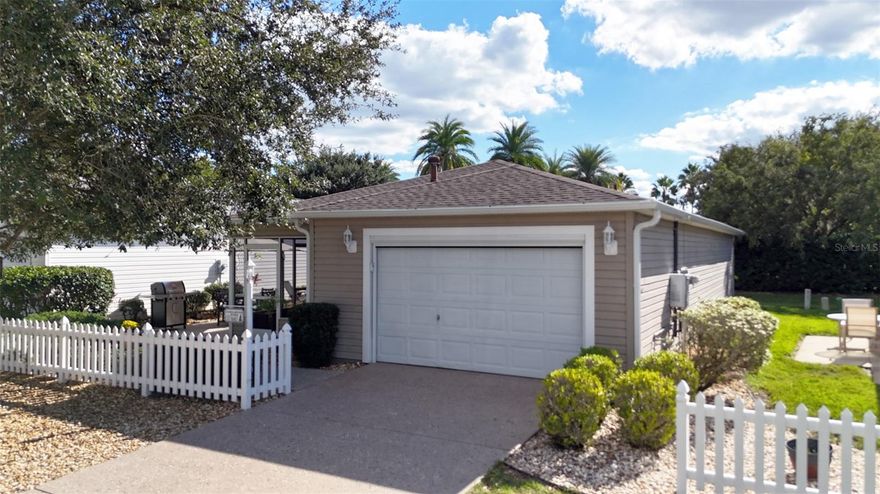 If you are looking for the best patio villa located in the best location, your search stops NOW! This extremely updated villa is located in Hickory Grove Villas in the Village of Sunset Pointe, smack dab in that middle point between Rt 466 and Rt 466A. Take your golf cart for a quick ride to Lake Sumter Landing or head south to Brownwood. You’re in the middle of everything!

Now that we have the location figured out, let’s take a look at what makes this house so special. How about NO backyard neighbors, cross the street to Cane Garden Country Club, and a painted and textured driveway? Check out the all new (2025) HVAC unit, tankless hot water heater (2025) and that epoxy garage floor? You’ll be happy to see it also has a new (2025) Nova water filtration system also!!

Moving to the inside of the house, ther is NO CARPET, just tile and LVP flooring throught the house. The kitchen and bathrooms feature granite counters and a matching granite backsplash in the kitchen. There are three solar tubes to brighten up the kitchen and baths, and wait until you see the totally remodeled and updated Master Bath! You haven’t seen a patio villa bath like this one before!

Don’t worry about appliances breaking down because there is a new LG brand washer, dryer and refrigerator waiting for you!

The front patio features tile flooring and the only grass is a small area in the back yard you can easily take care of. The front and side features a very innovative rockscape design!

If you’re not convinced yet that this is the Patio Villa for you, it also includes furnishings for the living room and dining room! That includes a quality leather sofa and loveseat and a TV complete with a useful wall unit! Start enjoying your home immediately!

Make it a point to check out this great property in a fabulous location TODAY! You’ll be glad you did!