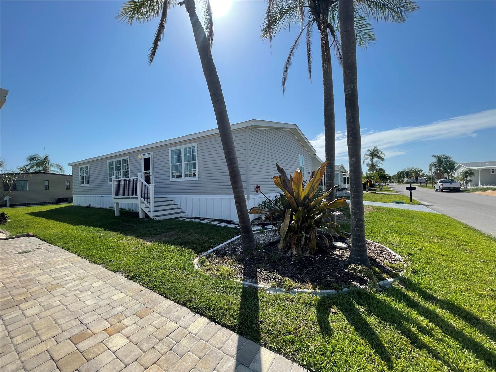 HUGE PRICE DROP – Motivated Sellers! This beautifully updated 3-bedroom, 2-bath 2014 home is located in the highly desirable, gated 55+ community of Kings Gate Club. Featuring an open floor plan with vaulted ceilings, the home includes a brand-new kitchen with stainless steel appliances, butcher block countertops, custom cabinetry, and an extended island with pendant lighting. Recent updates also include new vinyl flooring, fresh interior paint, new porches with stairs, updated trim, and modern finishes throughout. The spacious primary suite offers a walk-in closet, soaking tub, walk-in shower, and double vanity, while two guest bedrooms bring in plenty of natural light. Additional highlights include an indoor laundry area, pantry/storage space, and an outdoor workshop. Kings Gate Club offers resort-style amenities including a heated, cooled, and 24-hour lit outdoor pool with an adjacent hot tub room, saunas in the men’s and women’s restroom areas, a fitness center, library/billiard room, game room with poker table, ceramics and crafts room with a kiln, woodworking shop, and a large DVD library. Outdoor recreation includes 12 shuffleboard courts, a tennis court, four pickleball courts, a bocce ball court, and a 9-hole miniature golf course. The main clubhouse features a 400-person Great Hall with a stage, a full AV booth, induction loop technology, and ADA accessibility, along with a multi-purpose activity room, administrative offices, and a fully equipped commercial kitchen. Conveniently located just minutes from beaches, shopping, dining, I-75, and Sarasota Memorial Hospital, this home is an exceptional opportunity you don’t want to miss!