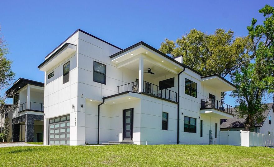 Exceptional Modern residence available for lease. This 3 bedroom 3 1/2 baths  with flex room is perfect for luxury, space and convenience. This  stunning contemporary residence offering high-end design, clean architectural lines, and exceptional indoor-outdoor living. This modern home features soaring ceilings, dramatic high impact windows, and a light filled open-concept layout. Designer finishes include sleek porcelain tile flooring, a custom cable railing staircase, and statement lighting through out.  This gourmet kitchen is designed for both style and functionality, featuring high-end Samsung Smart Thing appliances including a versatile microwave with convection and air fryer capabilities, full size oven with a sleek range. A spacious walk-in pantry for ample storage, while the thoughtfully selected appliances and finishes are known for their quality, and performance. The kitchen flows naturally  into the living and dining areas, outdoor patio ideal for everyday living and entertaining. The expansive primary suite with modern coffered ceiling serves as a true retreat with a private balcony complemented by a huge walk-in shower with rain shower head  and a very large walk-in closet. Generous second primary suite complete with a stunning modern bath area and spacious closet. The additional bedroom upstairs with a private en-suite bath, offering privacy for guests or family members. Upstairs features an additional private balcony, ideal for a serene retreat. The fully fenced in backyard provides a outdoor setting for entertaining, enjoying pets, or enjoying Florida living. This home includes a modern garage and paver driveway, all contributing to the home's upscale appeal. 
Ideally located with convenient access to the beaches, top-rated restaurants, Tampa International Airport, Tampa General Hospital, and downtown Tampa-placing you close to everything to meet your needs. A rare opportunity to lease a true luxury modern home with the look and feel of a $1.5+ million dollar property.