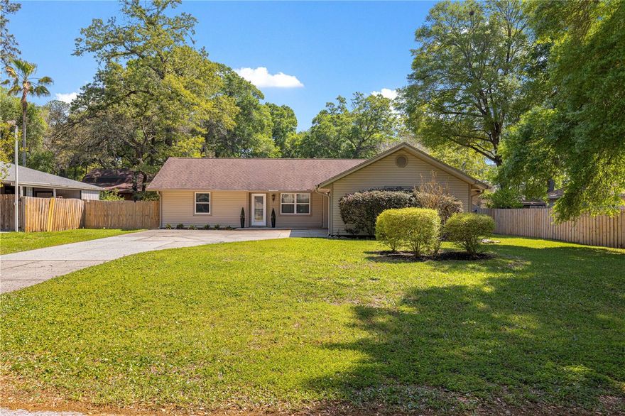 Warm, inviting, and move-in ready—this beautifully maintained 3-bedroom, 2-bath home with a 2-car garage offers character, comfort, and major system updates for peace of mind.

Step inside to cathedral ceilings accented with stunning wood beams and a striking stone fireplace that creates the perfect focal point for cozy evenings. The open living space is enhanced by tile flooring throughout, offering both style and easy maintenance.

The kitchen and dining areas flow seamlessly, ideal for everyday living or entertaining guests. Natural light pours in through updated windows and a sliding glass door (2017), bringing the outdoors in.

Enjoy the confidence of big-ticket updates already completed: roof, HVAC, windows, and slider all replaced in 2017, plus a water treatment system and gutter system with leaf guards installed in 2018.

Outside, you’ll find a large parking area with plenty of room for multiple vehicles, guests, or recreational toys.

Ideally located just 10 minutes from Downtown Ocala, you’ll enjoy quick access to local dining, shopping, and entertainment. Nearby attractions include the scenic Silver Springs State Park, the renowned World Equestrian Center, and the beautiful Ocala National Forest—offering endless opportunities for outdoor recreation.

This home blends rustic charm with modern updates—perfect for buyers seeking both personality and practicality.