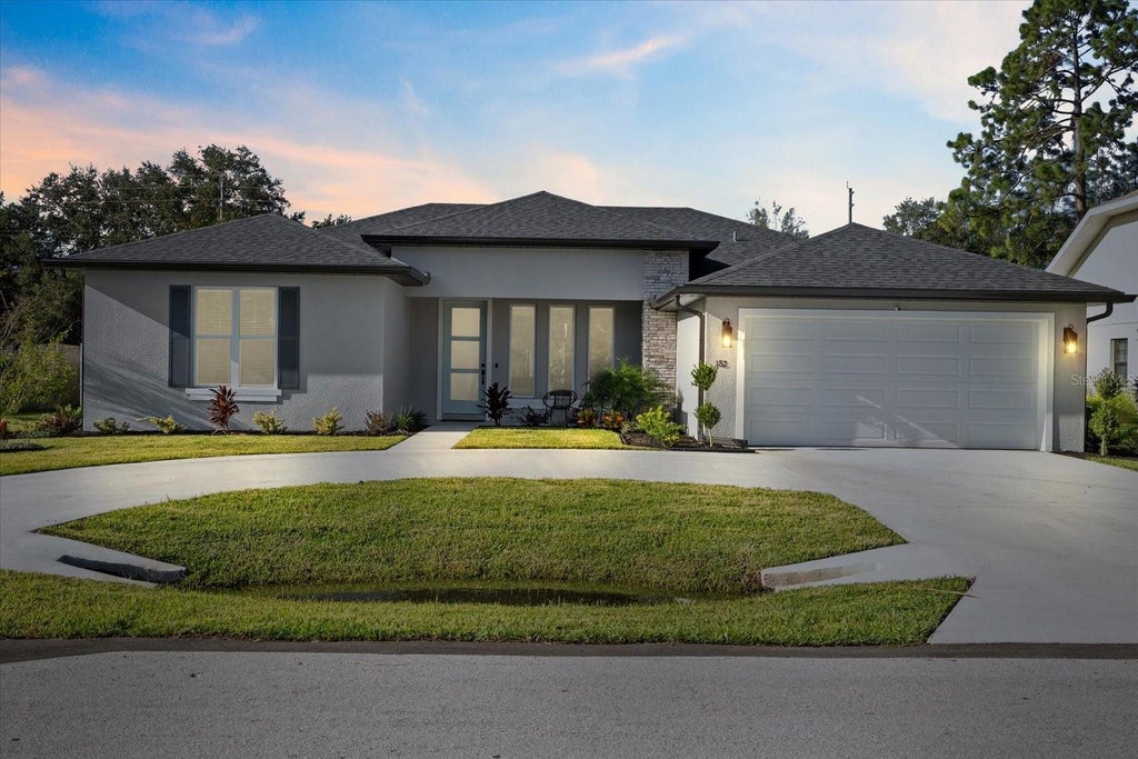 Photo of 94 Forest Hill Drive, Palm Coast, FL 32137 (MLS # FC320623)