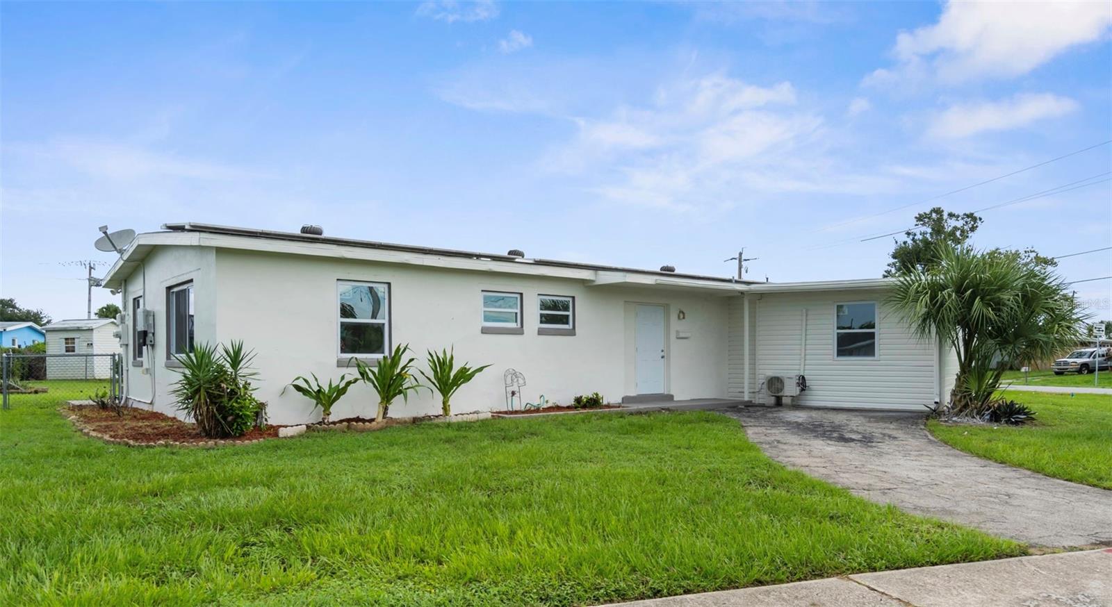 Step into this completely updated 4 bed, 2 bath home in the heart of Port Charlotte—where modern style meets everyday comfort. Situated on a spacious corner lot, this home offers extra yard space! Inside, you’ll find a wide open floor plan, luxury vinyl flooring throughout, and some impact-rated windows that bring in tons of natural light while offering peace of mind and energy efficiency. The living area features a cozy fireplace, adding just the right touch of warmth and character—perfect for laid-back evenings or hosting friends. The kitchen has been fully updated with clean finishes and flows right into the main living space, making entertaining easy. Both bathrooms have been beautifully remodeled, and each bedroom offers plenty of space and natural light. Out back, there’s a concrete pad—ready to enjoy as-is or easily screen in for extra outdoor living space. With no HOA and no flood zone, you’ve got the freedom to make it your own.
Totally move-in ready—just minutes from shops, dining, beaches, fishing, golfing, and much more!