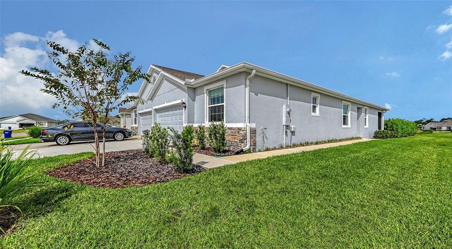 One or more photo(s) has been virtually staged. GORGEOUS villa on a corner lot with conservation nature views in the popular gated community of Coddington! Conveniently located on a cul-de-sac turn, this sparkling clean and almost new, 3 bed, 2 bath, 2 car garage villa is ready to be loved by the new owners! Beautiful stone accents on the front of the villa and a nice pathway welcomes you around to a side entry. There's an UPGRADED ceiling fan in the living room and on trend tile flooring throughout the open concept kitchen, dining and living room. The kitchen is a perfect place to entertain family and friends with gorgeous granite countertops, crown molding accents on the cabinets, a nice sized kitchen island and walk in pantry. Stainless appliances in the kitchen and a full sized washer and dryer, all new in 2023. All 3 bedrooms have UPGRADED luxury vinyl flooring, complimenting the designer inspired color tones throughout the villa. The primary bedroom has a relaxing view of the preserve, an upgraded tray ceiling and ceiling fan along with a generous sized walk in closet, ensuite bathroom with granite counters, dual vanity sinks and large walk in, tiled shower. The second bathroom also has granite countertops and a tub with shower. The screened in lanai has a view of the lush tropical preserve, upgraded ceiling fan and custom privacy shades. What a beautiful space to enjoy nature views and warm tropical breezes. The owners even UPGRADED the landscaping along the side of the backyard adding an attractive line of tropical plants for even more privacy! Lawn care is included in the low monthly HOA fee. The community of Coddington is resort style living at it's best with a heated community pool, covered cabana and playground in a perfect location near stunning gulf beaches, delicious restaurants, world class shopping, fun local activities, Lakewood Ranch and so much more! Isn't it time to make this wonderful villa yours?