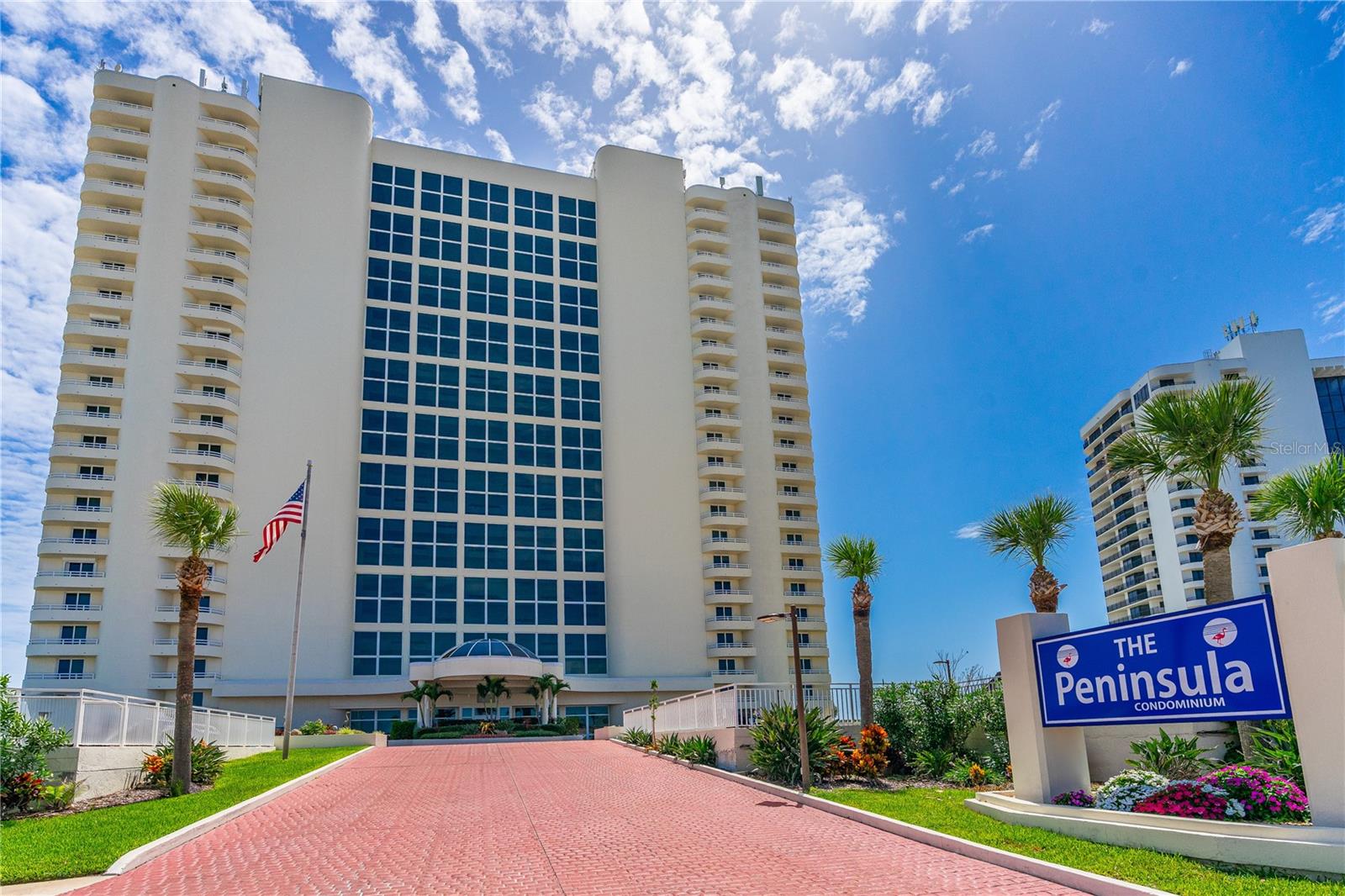 Experience unparalleled luxury at The Peninsula Condominium, an oceanfront gem in Daytona Beach Shores, voted the best condo building in the Shores for 2022, 2023, and 2024. This stunning first-floor, furnished 2-bedroom, 2-bathroom residence offers breathtaking Atlantic Ocean views from the primary bedroom and living room, complemented by all hurricane-impact windows and sliding doors. Step into an open concept living/dining room combo with a kitchen breakfast bar, pantry, in-unit laundry, and spacious bedrooms. Walk out your sliding doors to a large patio enveloped by a lush green lawn, perfect for relaxation.
The Peninsula redefines elegance with its atrium featuring an indoor river and waterfall, a penthouse club room with panoramic views, an indoor heated pool, outdoor pool, inground heated spa, outdoor grills, fitness center, billiards, ping pong, library, and card room. With all assessments paid, a robust building budget, and recent restoration, this community is as financially sound as it is luxurious. Ideally located near shopping, dining, and entertainment, this is coastal living at its finest.
Don't miss this rare opportunity to own a piece of paradise! Schedule your private tour today and seize the chance to live in unmatched luxury.