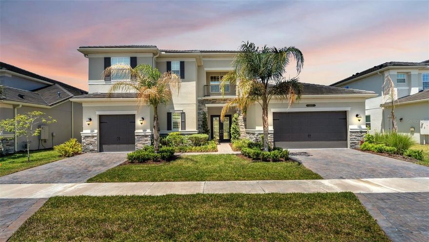 Welcome home!! This stunning 4,501 sq ft home is pure luxury. This is the Amethyst floor plan by GL homes. It features tons of upgrades and is move in ready. The floor plan includes 4 bedrooms, 5 full bathrooms, a half bath, library/office, a 3-car garage and a huge playroom/movie room upstairs. This home is fully upgraded and has high end finishes throughout. Once you enter through the front doors you'll notice how light, bright and open the floor plan is. The living room has high celings which opens up to the huge gourmet kitchen. The kitchen includes quartz countertops, stainless steel applicances, a gas range, 42" wood cabinets, and an oversized center island. The first floor also features an office/library, wet bar, powder room (1/2 bath), formal dining room, a full bathroom, a guest bedoom w/ ensuite, and the primary suite. The primary suite features 2 walk in closets, a walk-in shower, a double quartz vanity, and a soaking tub.  The majestic staircase takes you up to the 2nd floor, which features 2 bedrooms, 2 bathrooms, and the theater/playroom. The tile roof and brick paved driveway complete this immaculate home. Conveniently located close to the community clubhouse. The residents of Winding Ridge enjoy amazing amenities with a magnificent clubhouse, resort-style pools, fitness center, racquet sports, basketball hoops, acres of pristine preserves, sparkling lakes, and a stunning multimillion-dollar entry to welcome you home everyday. The HOA fee includes- lawn mowing, landscap maintenance, fertilization, mulching & exterior pest control. Winding Ridge is one of the most desirable developments in central Florida and is centrally located on SR-56 near the Wiregrass Mall, Tampa Premium Outlets, USF, Moffitt Cancer Center, Advent Health Hospitals, Pasco State College, Center Ice, I-75 & I-275 + easy access to I-4. 30 min drive to downtown Tampa & Tampa Int'l Airport. Call for your private showing today.