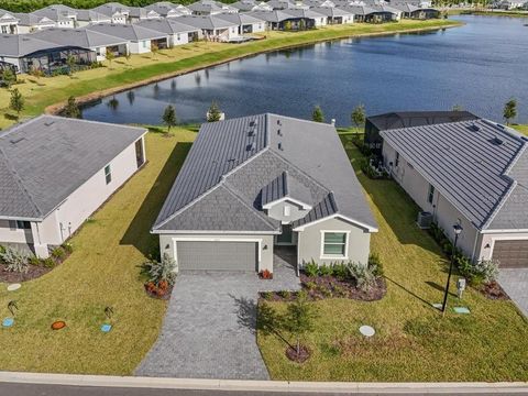Photo of 7875 Lakes Edge Lane, Port Charlotte, FL 33981 (MLS # D6144121)