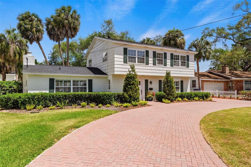 An exceptional opportunity in South Tampa. This classic Colonial sits on a generous 82 x 137 lot (over a quarter acre) in a highly desirable location. A circular brick paver driveway creates a welcoming first impression as you arrive at this meticulously cared-for home, owned and thoughtfully maintained by the same owner for more than four decades. Inside, you’ll find bright, inviting spaces and a long list of updates completed over the years. Highlights include wood flooring throughout, a fully updated kitchen, renovated bathrooms, a newer roof (just two years old), updated HVAC system, and newer windows. The traditional center-hall foyer offers a timeless layout, with a spacious living room on one side and a formal dining room on the other. The updated kitchen features crisp white cabinetry, quartz countertops, and modern appliances, flowing seamlessly into a large family room filled with natural light and anchored by a wood-burning fireplace—perfect for everyday living and entertaining. Out back, the expansive yard provides plenty of room to enjoy the outdoors. A breezeway leads to an oversized garage with space for two vehicles plus additional room for a workshop, storage, or hobbies. Upstairs, you’ll find three secondary bedrooms, an updated hall bath, and a comfortable primary suite. Move-in ready and exceptionally well maintained, this home is also zoned for sought-after schools: Dale Mabry Elementary, Coleman Middle, and Plant High. A rare combination of space, condition, and location—ready for its next chapter.