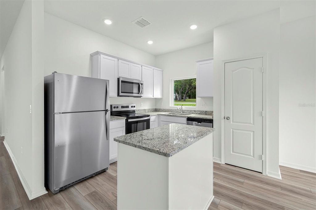 Photo of 13343 Tula Loop, Astatula, FL 34705 (MLS # TB8508377)
