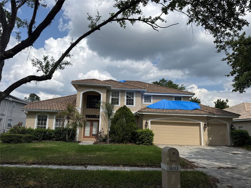 $13,298 seller credit toward closing costs or rate buy-down on any full-price offer accepted by 05/31/26. NEW Photos coming!! Fully updated 5-bedroom, 4-bath pool home w/bonus room and 3-car garage on a conservation lot in gated Arbor Greene, just under 4,000 sq ft. Major recent work: brand-new barrel tile roof, both HVAC systems replaced (new 4-ton and 3-ton Lennox), and a remodeled kitchen with new white shaker soft-close cabinets, white ornamental granite counters, undermount sink, new MOEN faucet, new stainless slide-in range, new stainless microwave hood, LED recessed lighting, and updated outlets/switches throughout. Full interior repaint in Sherwin-Williams Alabaster (walls, trim, and doors). Tile and hardwood flooring throughout the main level; new LVP stair treads. Family room features built-ins, gas fireplace, and a wall of sliders to the lanai. Primary suite is on the first floor along with a separate guest suite w/private bath. Three bedrooms upstairs plus a large bonus room for media, office, or flex space, with an additional smaller flex room off the entry. Pool and spa overlook the conservation area for a private backyard setting. Additional updates include new toilets, replaced bath fixtures, new laundry counter, fresh landscaping, and updated irrigation. Arbor Greene amenities include a community center, multiple pools, fitness facilities, and walking/biking trails. Convenient to I-75, with A-rated elementary and middle schools nearby.