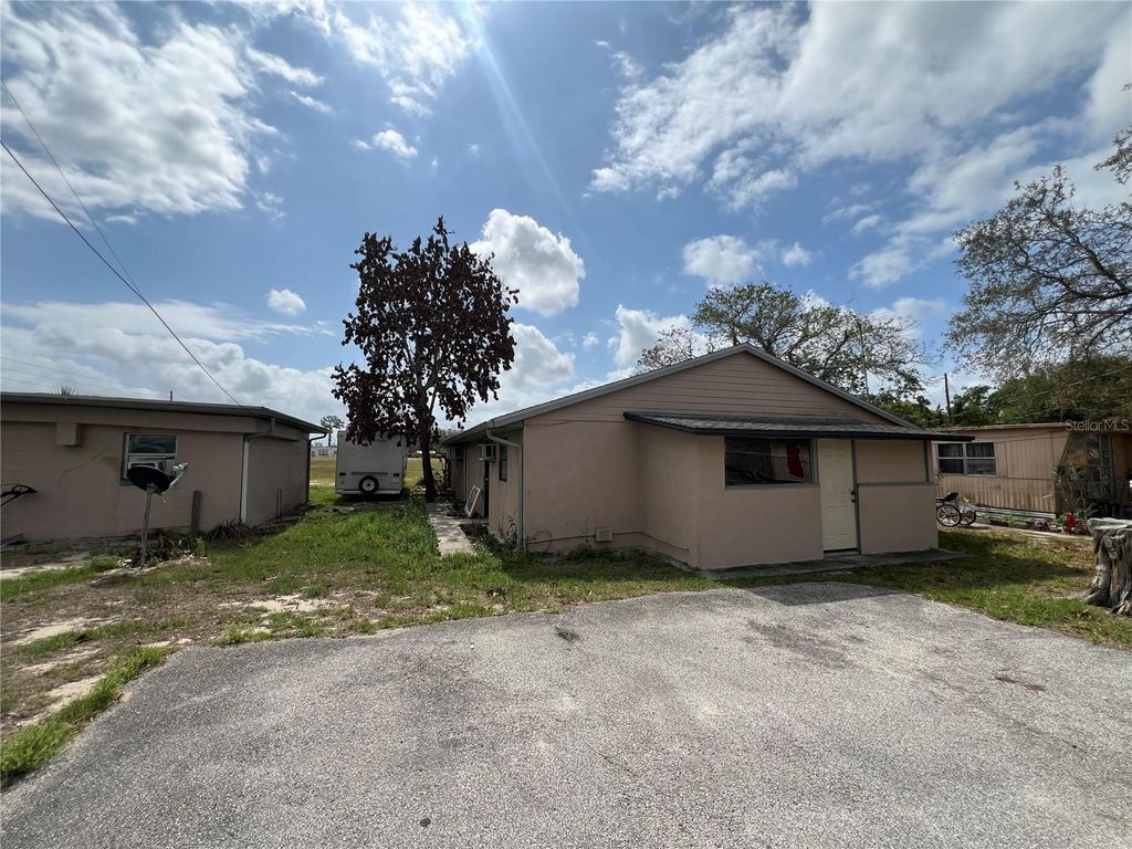Photo of 617 E Myers Boulevard, Mascotte, FL 34753 (MLS # O6395319)