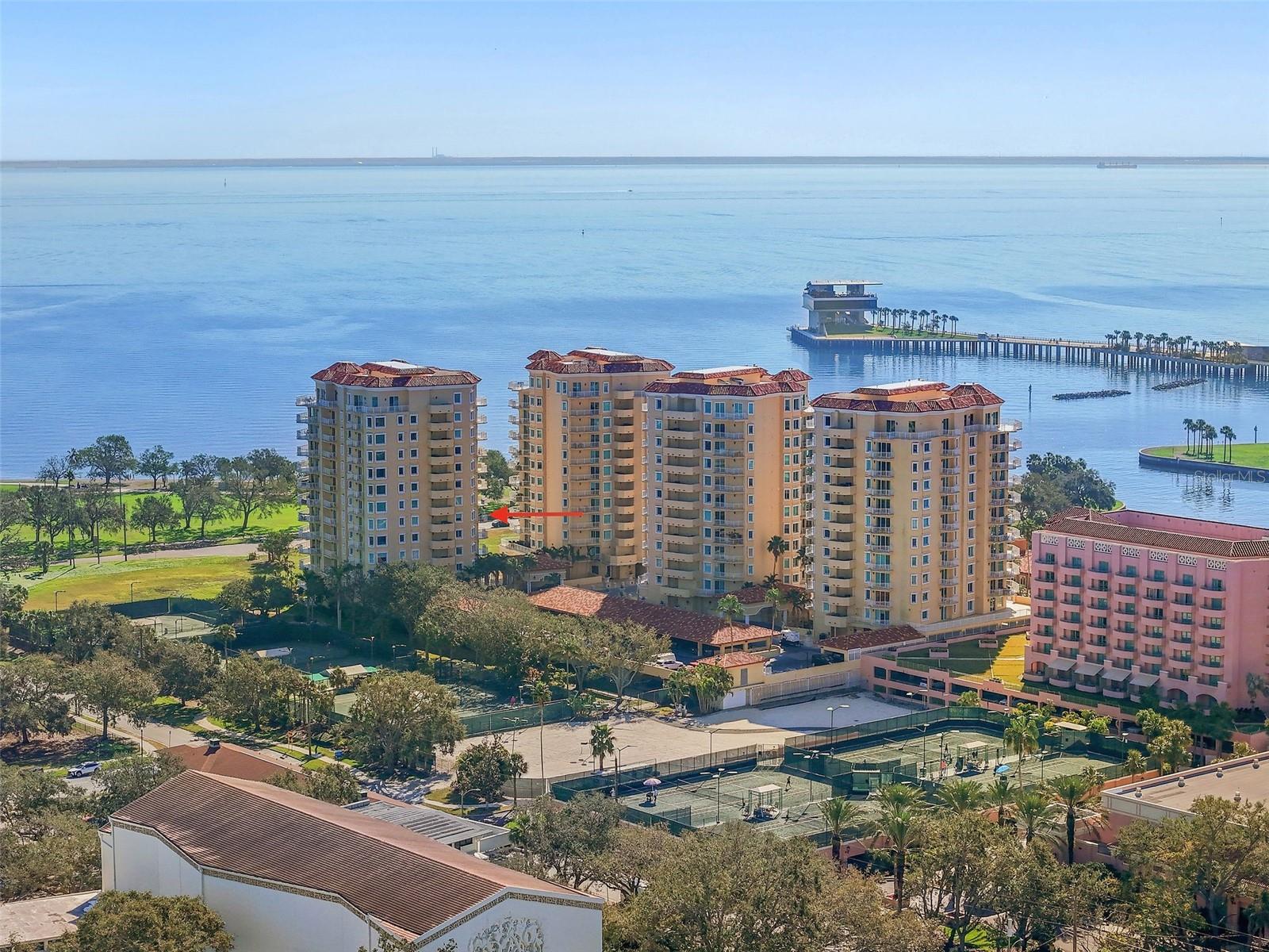 One or more photo(s) has been virtually staged. LUXURY WATERFRONT LIVING IN DOWNTOWN ST. PETERSBURG
Experience the best of both worlds—vibrant downtown living with serene, unobstructed views of Tampa Bay and the waterfront park—at this stunning 3-bedroom, 2.5-bath residence at The Vinoy Place. Perfectly positioned in the front row to the water, this spacious 3,000 sq ft apartment offers a rare blend of tranquility and city access.
Enjoy the peaceful ambiance from the wraparound terraces that extend from the airy living and dining rooms to each of the three bedrooms. The double-pane sliding doors allow you to choose quiet seclusion or enjoy the distant sounds of waterfront festivals at your leisure.
Inside, a bright and open layout features a den/library, a well-appointed kitchen with breakfast area, and expansive living and dining spaces filled with natural light. This home also includes a private storage unit and two assigned parking spaces.
The Vinoy Place community offers premium amenities: two resort-style swimming pools, a new outdoor kitchen and BBQ social area, elegant indoor entertaining spaces with kitchen, bar, and pool table, plus a fully equipped gym. Enjoy peace of mind with 24-hour gate guard and concierge services.
All four towers have passed the Structural Integrity Milestone Inspection and remain unaffected by storms or natural disasters.
Don’t miss this rare opportunity to own a front-row seat to downtown St. Pete’s finest waterfront lifestyle.