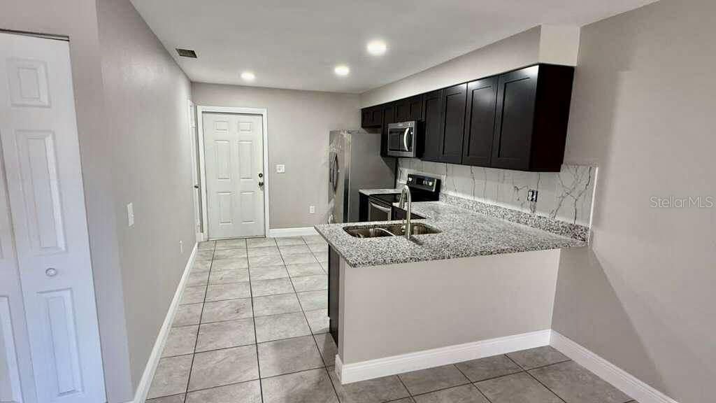 Photo of 249 Century Boulevard #A, Auburndale, FL 33823 (MLS # S5137491)