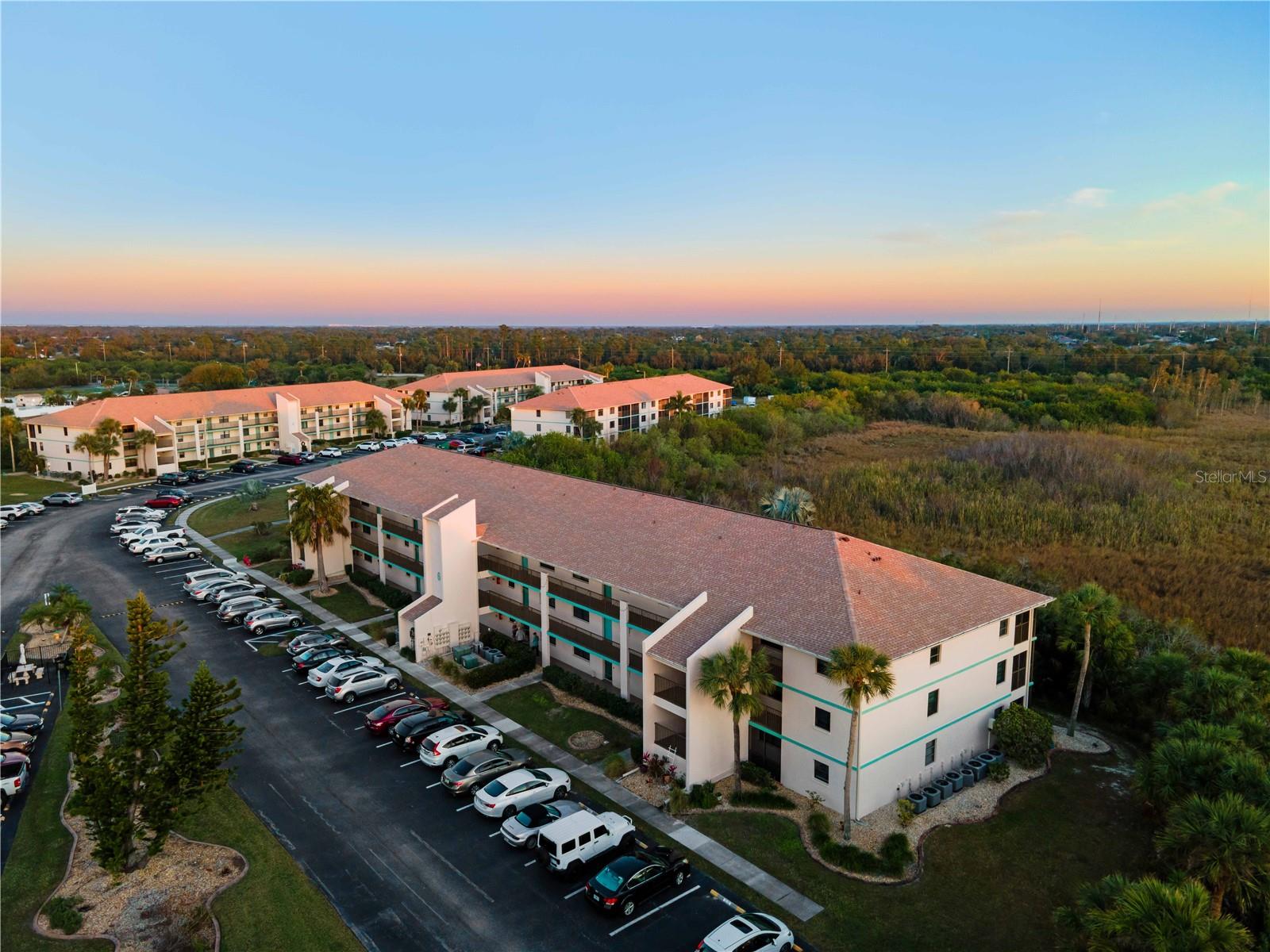BEST VALUE CONDO IN CHARLOTTE COUNTY! Discover this inviting 2-bedroom, 2-bathroom condo featuring an open-concept layout with a split-bedroom design, seamlessly integrating the living and dining areas. NO CARPET in the entire unit, this unit features awesome LVP floors and tile. The well-appointed kitchen includes a breakfast bar, ample cabinetry, generous counter space, and comes equipped with all necessary appliances. The spacious master suite offers a walk-in closet, vanity, and a walk-in shower, while the sizable second bedroom is complemented by a guest bathroom featuring a tub/shower combination. Excellent outdoor space overlooking the preserve. An interior laundry area accommodates full-sized washer and dryer units. A new roof was installed in February 2023. The condominium complex boasts a range of amenities, including a large heated pool, tennis courts, shuffleboard, a grill area, and a clubhouse. Conveniently situated near I-75, Walmart, golf courses, and a variety of dining options, this property offers both comfort and accessibility. Dont wait schedule your private showing now!