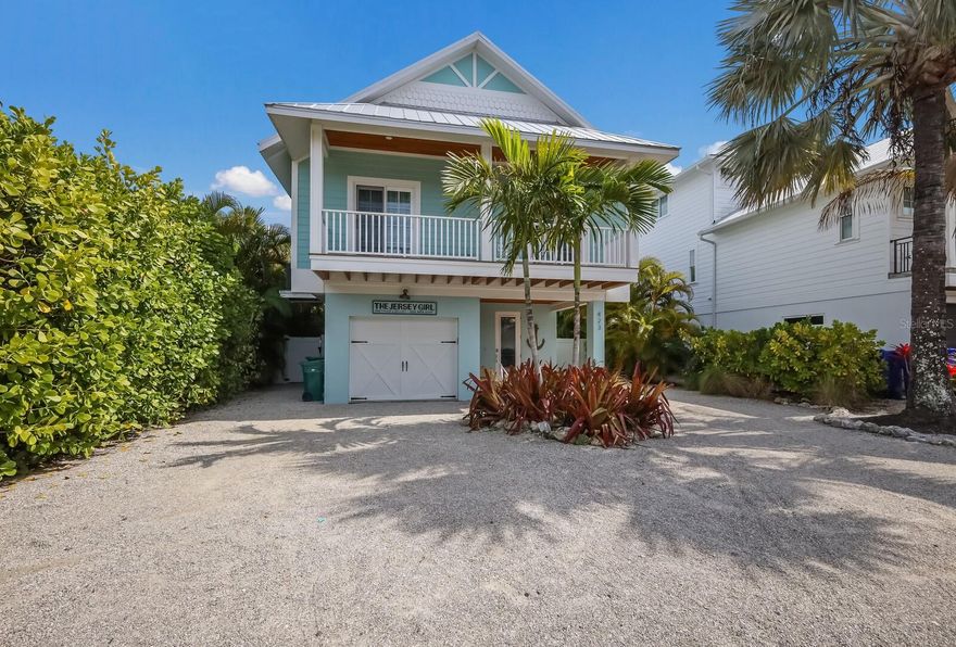 This exquisite turnkey furnished residence offers a ready-made vacation retreat in the heart of Anna Maria Island. Situated just a block away from the vibrant Pine Avenue, this coastal-inspired property encompasses a main house boasting 3 bedrooms and 2 baths, complemented by a charming guest cottage featuring 2 bedrooms and 1 bath. Built in 2015, the home epitomizes modern comfort and style, with tasteful decor throughout. Step inside to discover a spacious gourmet kitchen seamlessly flowing into the inviting living areas, perfect for hosting gatherings and creating lasting memories. Beyond the interiors, the outdoor living space beckons, featuring a private heated pool with cocktail table and sun shelf all situated between the main house and guest cottage, providing an idyllic setting for relaxation and entertainment amidst the island's tropical ambiance. The unique layout of the home is perfect for a multitude of uses, offering separate spaces for privacy and togetherness. Enjoy the convenience of a 1-car garage, providing ample storage space for a vehicle and beach essentials. Conveniently located within walking distance to both Gulf and Bay beaches, as well as a myriad of dining and shopping options along Pine Avenue, Jersey Girl offers unparalleled access to Anna Maria's coveted amenities. Short-term rentals are allowed, adding to the versatility and investment potential of this remarkable property. With a Bert Harris Exemption, this property is approved to sleep 12 people per Anna Maria City code, presenting an exceptional investment opportunity. Whether you're seeking a primary residence, a second home, or a lucrative vacation rental, Jersey Girl offers versatile possibilities. Make Jersey Girl your own slice of coastal paradise.