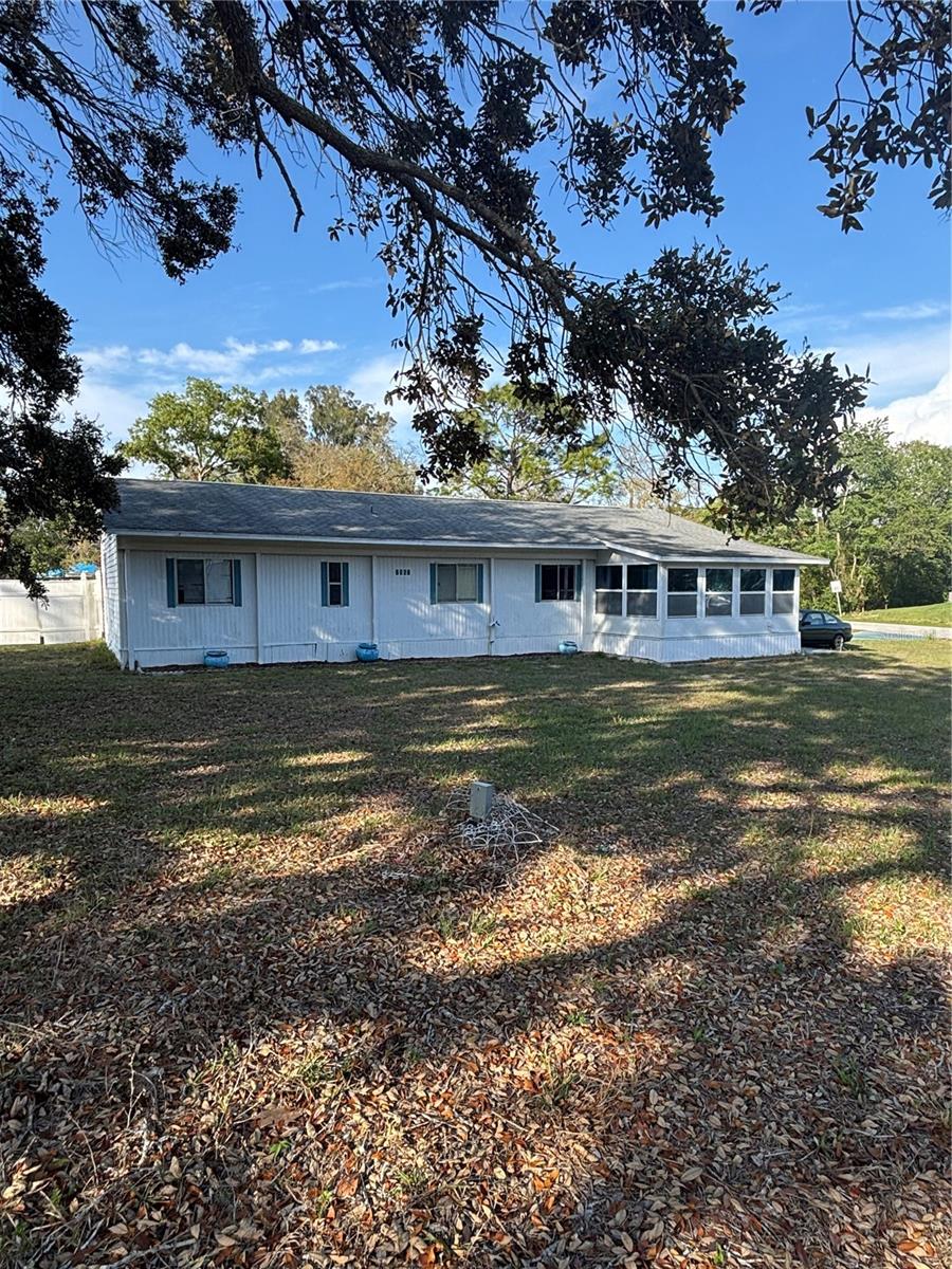Discover endless possibilities with this unique 2-bedroom, 1-bathroom mobile home nestled on an oversized .30-acre lot in Spring Hill, FL. This property offers a blend of privacy and functionality, featuring a partially fenced yard—perfect for pets—and a large screened lanai to enjoy Florida's outdoor lifestyle. Inside, you'll find an oversized indoor laundry room and a flex space that can be customized to fit your needs. A standout feature is the detached concrete block 2-car garage, complete with ample storage and a built-in workbench—ideal for hobbyists or additional workspace. Major updates include a 2021 roof, 2019 HVAC, and updated electrical (2019), providing peace of mind. While the home does need new subflooring, flooring, and miscellaneous repairs, it offers a fantastic opportunity for customization. With .30 acres of land, the potential is endless—whether you're looking for space to expand, a place for recreational activities, or just a serene retreat. Don't miss out on this rare find! Schedule your showing today!