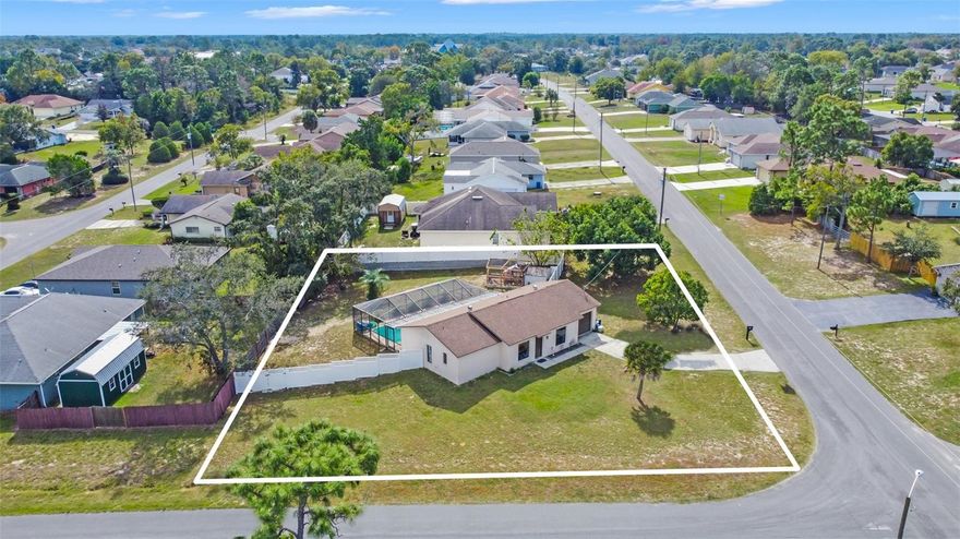 It's more than just a house; it's a place where memories are made! This adorable Spring Hill residence is situated on an oversized corner lot in a peaceful neighborhood with no HOA fees. Along with a new roof in 2015, this property offers a big fenced backyard, making it perfect for outdoor gatherings, gardening, or even just letting your furry friends run wild. Inside, an open-concept, split-bedroom floor plan creates a welcoming atmosphere. Stylish tile flooring in the living areas keeps maintenance simple. The kitchen is a highlight, with newer butcher block counters and gleaming stainless steel appliances that make meal prep a breeze. A well-appointed primary bedroom is actually quite spacious, offering private access to the lanai, an ensuite bathroom, and a walk-in closet that's sure to satisfy even the most enthusiastic shopper - no more wardrobe wars! But the real showstopper? The in-ground pool, a refreshing oasis where you can splash, sunbathe, or simply unwind under the Florida sun. Those with a fondness for fowl (or a craving for fresh eggs), might appreciate the large chicken coop in the backyard. Omelets for breakfast, anyone? Located in the heart of Spring Hill, you'll have access to a plethora of convenient amenities, like schools, shopping, and tons of local restaurants. Discover the magic of mermaids and the gorgeous glass-like waters of the river at nearby Weeki Wachee Springs State Park; it's less than 5 miles away, along with Delta Woods Park and Veterans Memorial Park. The stunning Gulf Coast beaches are an easy drive down US-19, and Tampa is easily accessible via the Suncoast Parkway. So pack your bags, bring your flip-flops, and come see this little piece of paradise for yourself!