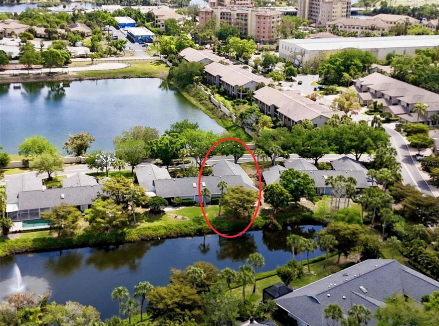 Discover an exceptional opportunity to own a beautifully renovated residence in the highly sought-after Portside Villas, located within the lush, gated enclave of The Landings. This 1,705-square-foot home combines modern elegance with timeless comfort, offering a seamless blend of style and functionality—perfect for both relaxed living and entertaining. Step inside to an open, light-filled layout featuring volume ceilings, neutral ceramic tile flooring, and a western wall of windows framing serene lake views and breathtaking sunsets. The expansive living room flows effortlessly into the dining areas, providing a perfect setting for gatherings both large and intimate. The chef-inspired kitchen is sure to impress, boasting 42-inch soft-close cabinetry, Quartz countertops, and brand-new Thermador stainless steel appliances. A formal dining room, cozy breakfast nook, and elegant dry bar with glass cabinetry offer versatile dining and entertaining options. The primary suite provides a private retreat with tranquil water views, generous closet space, and a luxurious en-suite bath. Two additional bedrooms offer flexibility for guests, a home office, or creative pursuits. Every detail has been thoughtfully curated—from fresh paint and new fixtures to hurricane-rated impact glass windows and doors and brand-new HVAC, ensuring peace of mind and lasting quality. Additional highlights include a spacious two-car garage and full hurricane protection for enhanced safety and convenience. Residents of The Landings enjoy exclusive membership to the Landings Racquet Club, featuring eight Har-Tru tennis courts, pickleball facilities, a heated swimming pool, fitness center, meeting rooms, and a well-stocked library. The community also provides 24-hour gated security and access to the natural beauty of Sarasota Bay.