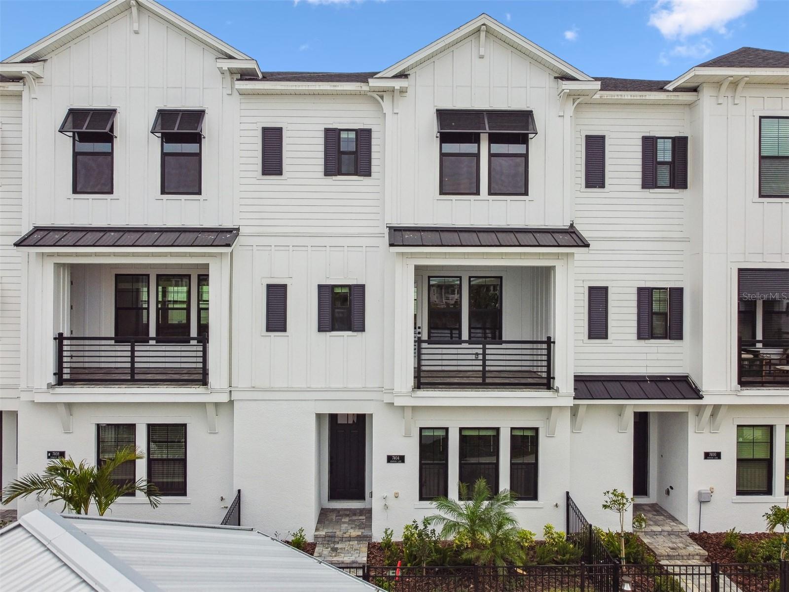 This spectacular City Home embodies modern living while giving you breathtaking views of Emerald Landing Amenity Center.
This north facing town home will allow you to enjoy morning sunrises with lights flooding into your living and owners retreat. Enjoy morning
coffee on your balcony overlooking the Emerald Landing amenity center and pool. Each bedroom has its own en suite bath with the master
bathroom offering a Rainfall shower head in the oversized Super shower upgrade. This modern city home has high impact hurricane windows and
has a private elevator. The oversized attached 2 car garage provides extra storage space and versatility. There is also extra storage under the
staircase. Enjoy maintenance free living, as all of your exterior landscaping, irrigation and exterior maintenance of city home will be handled by
the HOA.