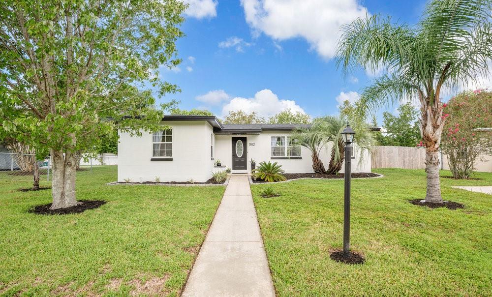 Under contract-accepting backup offers. Welcome to this beautifully renovated home in Deltona! This move-in ready residence has been thoughtfully updated inside and out, offering peace of mind and modern comfort. Step inside to find all-new luxury vinyl flooring flowing throughout, a freshly painted interior, and an inviting open layout. The kitchen has been completely remodeled with brand-new cabinets, sleek countertops, and stainless-steel appliances—perfect for everyday living and entertaining. The bathroom has been refreshed with a stylish new vanity, while fresh exterior paint enhances the home’s curb appeal. Major updates include a new roof (2023), new water heater (2023), and an updated electrical panel (2008), ensuring both efficiency and reliability. Enjoy the outdoors in your private, fenced backyard—ideal for pets, play, or relaxing weekends at home. This home is a fantastic opportunity for first-time buyers, those looking to downsize, or anyone seeking a move-in ready property with modern upgrades. Don’t miss your chance to make it yours!