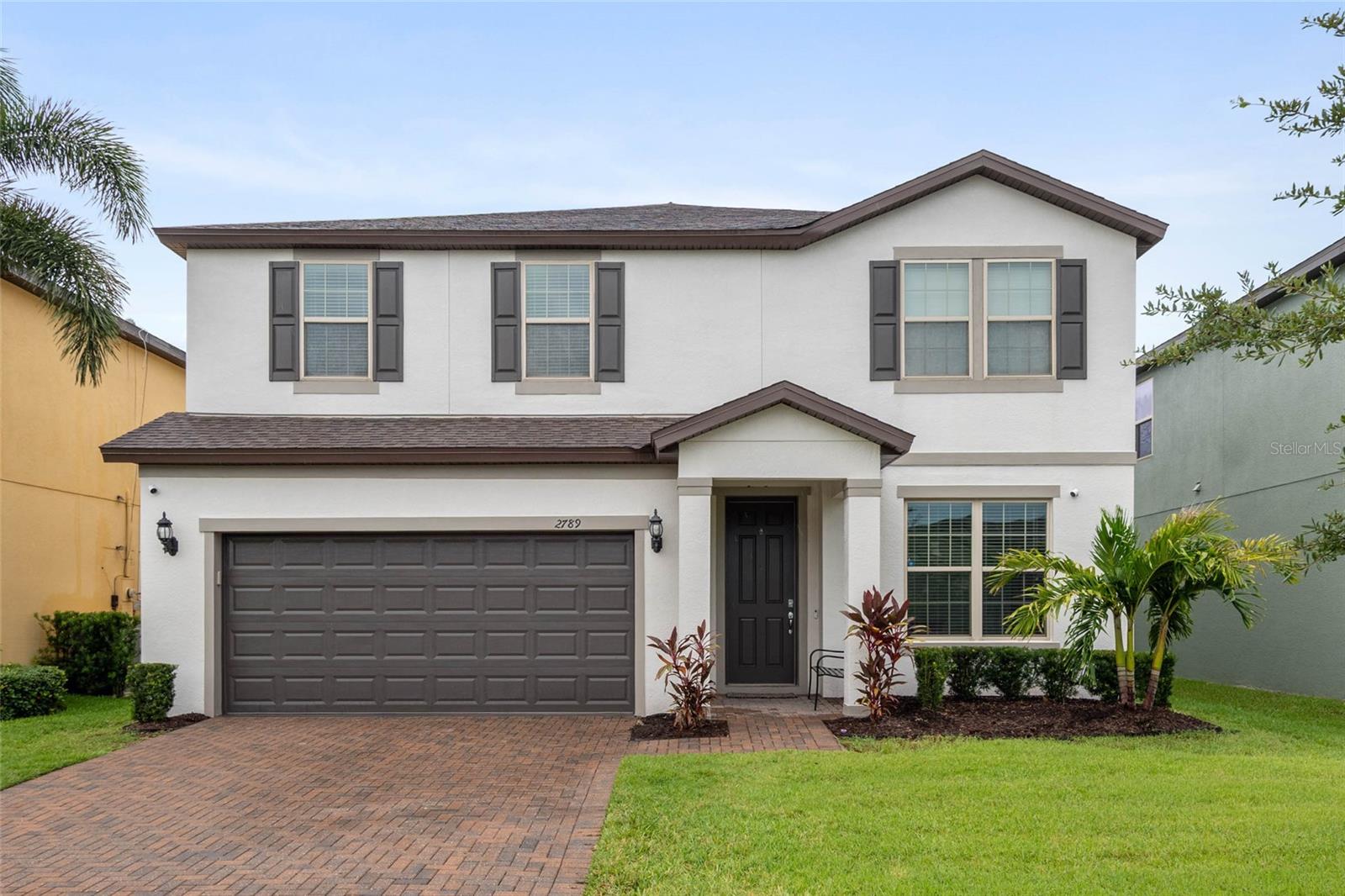 Looking for space, upgrades, and community amenities that go way beyond the basics?? Welcome to this beautifully maintained 4-bedroom, 2.5 bath home in the gated Lakeshore at Narcoossee where comfort, flexibility, and Florida living all come standard. Downstairs you’ll find an open layout made for gathering—large tiled floors, a chef’s kitchen with granite throughout, oversized cabinets, huge island, and corner pantry. Off the foyer, a flex room with French doors makes the perfect home office or quiet retreat. This home boasts tons of storage, including a large under-stair space. An additional flex room is also on the first floor. Step outside to a screened-in lanai, paver patio + private HOT TUB, all within a fully fenced yard. Upstairs features 4 bedrooms + a loft-style bonus/game room ideal for movie nights, gaming, or play. The oversized 2-car garage (20x24 ft!) gives you all the room you need for storage, projects, or parking. This community is next level with its gated security, fitness center, resort-style pool and dog park. Additionally there is a basketball court, walking trails, clubhouse, and more! For an additional fee there are boat slips and dock access to East Lake Toho. Close to Lake Nona, shopping, schools, and dining. Don’t miss out on making this beautiful home yours!