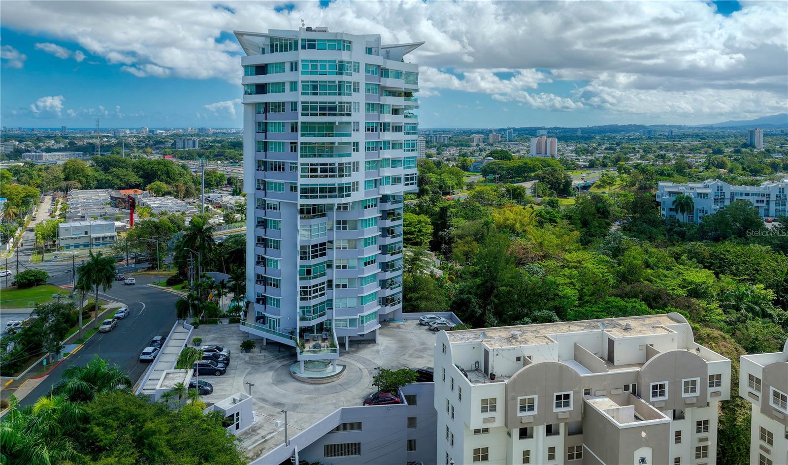 Exceedingly stylish and modern, this fully-remodeled abode is comprised of two separate apartments that were converted to create the ultimate home within La Cima de Torrimar, the pinnacle of luxury living in Guaynabo. Affording an air of refined elegance and timeless sophistication, this remarkable residence has been meticulously crafted to offer an unparalleled metropolitan lifestyle with mesmerizing views of the city's skyline. Spanning an impressive 5,351.52 Sq. Ft., the one of a kind floorplan houses half of the building's 17th floor and gracefully features 4 bedrooms convertible to 6 plus office, 5 bathrooms and 2 partial. The enviable primary bedroom with walk-in closet and private South-facing balcony is a sanctuary of serenity, showcasing an ensuite bath with jetted tub, glass-enclosed shower, separate His and Hers vanities as well as lavatories. A spectacular great room and wet bar add to the home's inviting allure, providing the perfect setting for memorable moments with friends and family. The expansive kitchen with breakfast nook is fully equipped for your culinary endeavors. Previously serving as a gallery, the generously-sized flex space with an abundance of natural light can be converted to whatever your heart desires. 6 Parking spaces are also included for additional comfort and ease. La Cima de Torrimar is an exclusive full-service building in Guaynabo. Top amenities such as 24-hour security, gym and pool are enjoyed by residents. Near highly-regarded schools such as Baldwin, Parkiville and Marista. Also within close proximity to multiple shopping venues, including San Patricio Plaza. A short drive away from San Juan, Isla Verde and Dorado. Every convenience is within reach from this exceptional penthouse in the clouds.