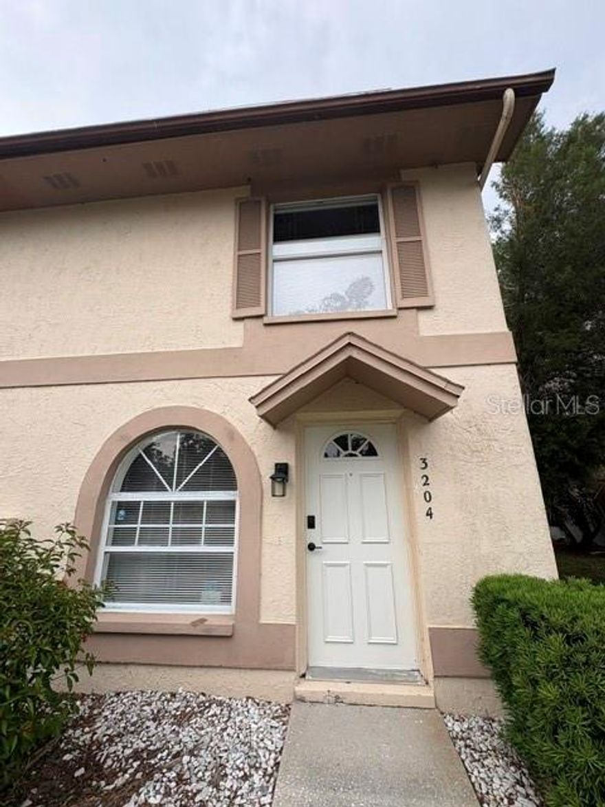 Located just 20 minutes from Clearwater Beach and 10 minutes from St. Pete-Clearwater International Airport, this updated end-unit townhouse sits in a quiet community with a pool, low HOA, and Kapok Park right outside the front door.

The home features a bright first-floor kitchen, living, and dining area with sliding doors opening to the backyard and mature landscaping. Both bedrooms are upstairs for added privacy. Recent 2025 updates include new luxury vinyl flooring throughout, a new microwave, and a new washer and dryer.

The kitchen offers white cabinets, stainless steel appliances, and wood countertops. Property is being sold as-is.