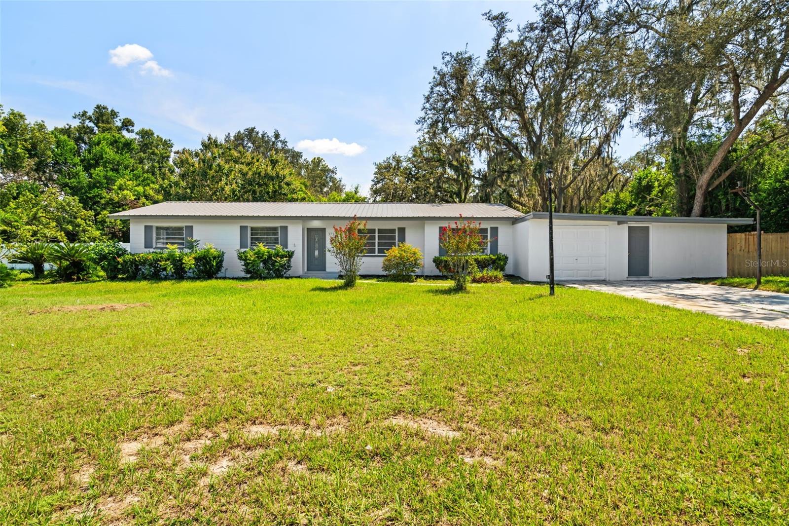 Welcome to 37312 Vero Lane, a fully renovated 3-bedroom, 2-bathroom home that blends the charm of quiet country living with the convenience of city amenities. Tucked away in a peaceful Dade City neighborhood, this home sits on an expansive lot with plenty of room to enjoy the outdoors. From brand-new finishes and fixtures to sleek new appliances, every inch of this property has been refreshed, making it truly move-in ready.
Inside, you’ll find a bright and open floor plan where natural light fills the spacious living areas. The stunning kitchen takes center stage with its modern cabinetry, stylish countertops, and new appliances, flowing seamlessly into the dining and living spaces—ideal for both entertaining and everyday living. Each of the three bedrooms offers comfort and style, while the two beautifully updated bathrooms feature contemporary finishes and thoughtful design.
A unique highlight of this property is the flex space near the garage—perfect for extra storage, a workshop, home gym, or creative studio. Outside, the large yard offers endless opportunities. There’s ample space to park a boat, RV, or recreational vehicles, while still leaving room for gardens, play areas, or simply relaxing in your own private retreat.
The location is unbeatable—less than two miles from Publix, popular restaurants, and AdventHealth Hospital, with the charming, historic downtown Dade City just minutes away. Explore local antique shops, cafes, and community events, or enjoy outdoor adventures at nearby Withlacoochee State Forest. For added convenience, the property is a short drive to Wesley Chapel, Zephyrhills, and only about 40 minutes to downtown Tampa, offering quick access to endless shopping, dining, and entertainment options.
With its spacious lot, thoughtful renovations, and prime location, 37312 Vero Lane offers a lifestyle that feels both peaceful and connected. This property is ready to welcome its next owner—schedule your showing today and experience all it has to offer.