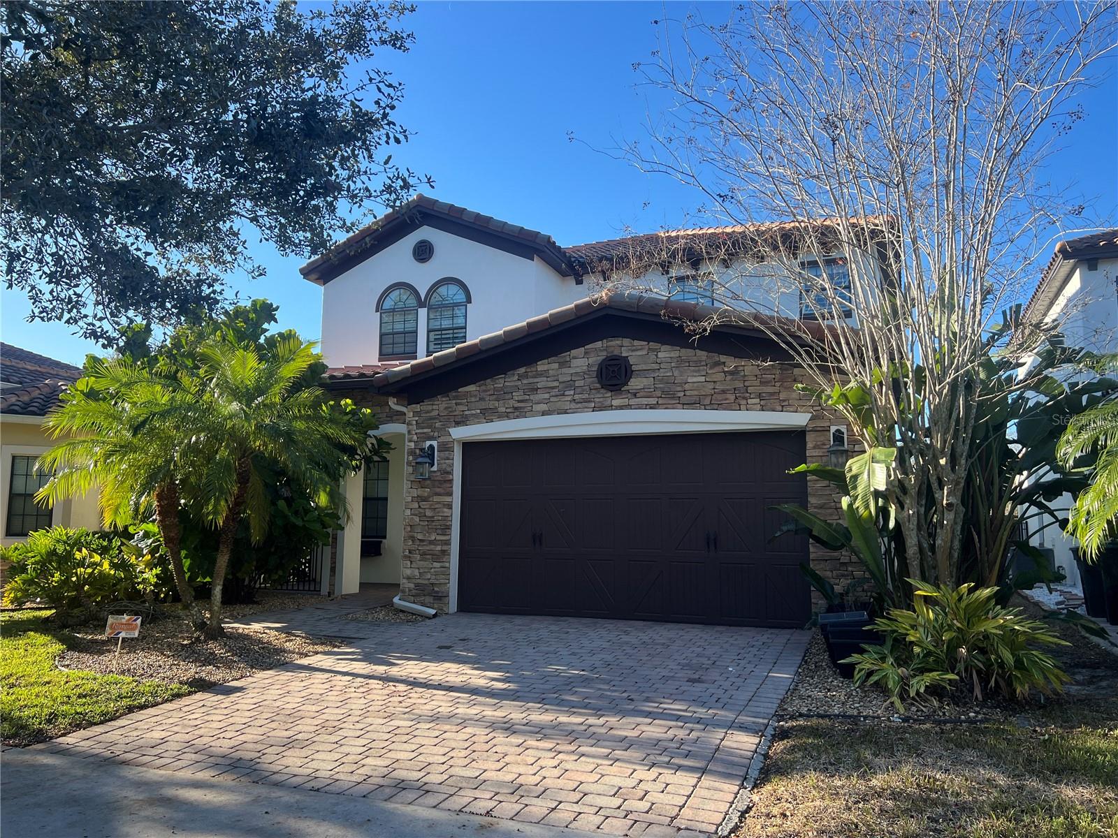 This magnificent home has 4 bedrooms, 4 bath and a lanai overlooking the Pool and Golf Course. You will know you have found your dream home when you approach and see the beautiful stone accented front of the home. Enter through the double entry doors to a formal living and dining room. Continue into the family room for those relaxing times or head out to the back yard enjoy and relax on the pool that overlooks the lake. The gourmet kitchen includes 42" upper cabinets,granite countertops and stainless steel appliances. Tile throughout the main living areas enhances the beauty of this home. IN addition to the guest bedroom on the first floor, upstairs there are 3 additional bedrooms also an oversized master suite and a bonus room with a bathroom, which will make a great game room or 5th bedroom.The gated golf community of Eagle Creek is located across from the new entrance to Lake Nona's Medical City featuring the Burnham Institute, UCF College of Medicine, Nemours Childrens Hospital, and VA Hospital. Don't miss this one!