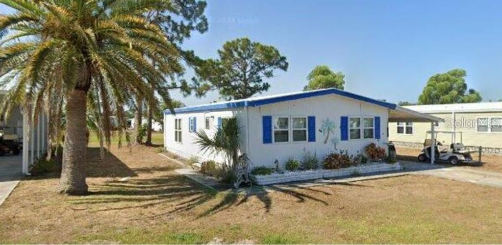 Photo of 7502 Fulmar Avenue, Port Charlotte, FL 33981 (MLS # D6146739)