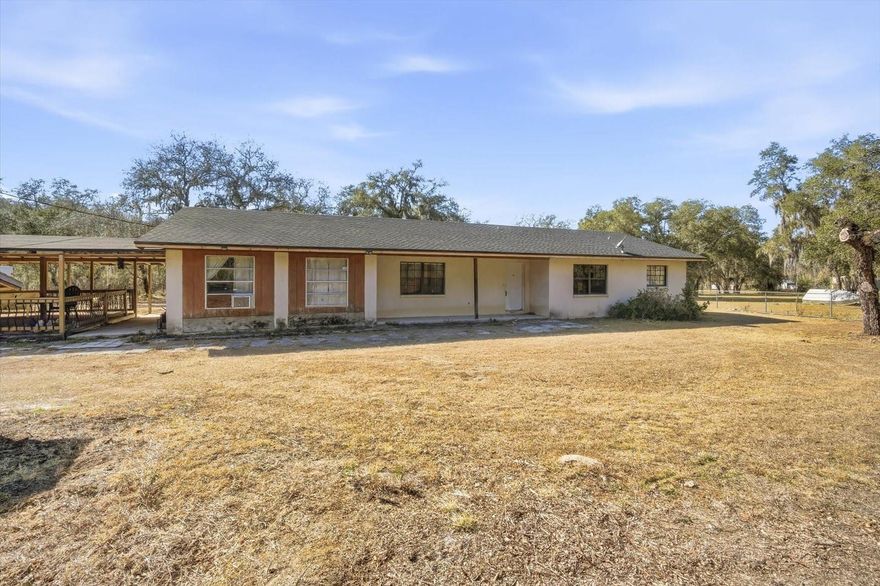 Rural and still 5 minutes from the highway! What a great location. Do not miss the over 2 acres of land awaiting new owners. Outside a beautiful covered porch greets you. Enjoy the time outside, looking at your land and enjoying nature. Side entrance takes you to a storage/ flex room with additional storage closet and laundry room. Kitchen is spacious and has lots of cabinets. Dining and living room combo give you lots of space to set up whatever you envision. Wood burning, stone fireplace can become a focal point for gathering. Off living room is another enclosed flex room. Secondary bedrooms and full bathroom are also off the living room. Both boast ample closet space and ceiling fans. Primary bedroom and bathroom round out the floorplan. Bedroom is spacious enough for large furniture and has a walk in closet. Bring your vision and make this your home today.