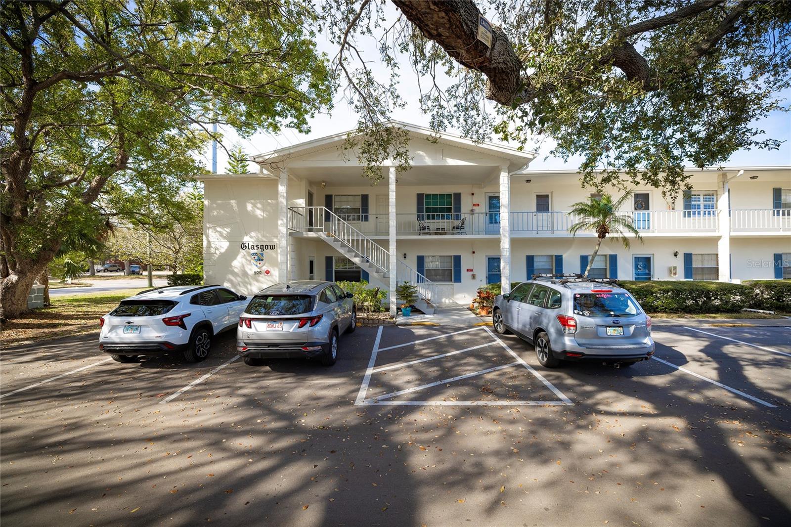 This 2 bedroom condo was impeccably designed to create a relaxing, coastal Florida feeling. The seller purchased in 2020 and called the remodeling project Simma i det blåa vattnet (Swimming in calm waters). New flooring, paint, fixtures and kitchen appliances were all thoughtfully chosen not only for style but also functionality. Comfortable for entertaining and easy to maintain, this home is truly move in ready! New A/C 2025 and new hot water heater 2020. One assigned parking space is included. Laundry facilities and storage room in the building. Douglas Arms is a quiet, 55+ community with a clubhouse that offers a library, kitchen, lounge, billiards, ping pong, shuffle board and a heated pool. Located just minutes from lovely downtown Dunedin with a lively cultural scene and plenty of family owned businesses and restaurants. Close to the Pinellas Trail, Dunedin Causeway and Honeymoon Island.