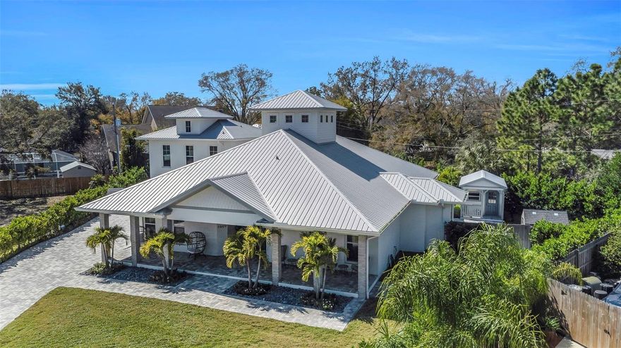 Nestled within the sought-after Palma Ceia West community of South Tampa, this immaculate custom-built home exudes charm and
sophistication. Boasting a spacious lot and soaring high ceilings, the light-filled interior invites you to experience luxury living at its finest. This
exceptional residence spans 3,040 square feet and features four bedrooms, three full baths, and two half baths. From the moment you arrive,
the flagstone pavers lead you gracefully from the driveway to the front porch, which spans the entire width of the house, offering a warm and
welcoming entrance. The exterior is adorned with striking brick columns, bordered by lush palm trees, shrubs, and St. Augustine sod, all
meticulously maintained with the help of a six-zone sprinkler system. Step inside to discover a thoughtfully designed open floor plan, seamlessly
connecting the gourmet kitchen to the adjoining living and dining areas. The kitchen is a chef's delight, equipped with top-of-the-line appliances
and accented by lightly tinted ceramic tiles that beautifully complement the Golden Gate quartz edge countertops and 36” farm sink. Luxury
abounds throughout the home, from the plank porcelain tile and luxury laminate flooring to the coffered ceilings in the dining room and the
dramatic cupola boasting shiplap trim above the main living room. The master suite beckons with a free-standing claw foot tub, walk-in shower,
and ample countertop space set against solid wood vanity cabinets. Additional interior features include a large laundry room, a walk-in pantry
with custom shelving, and a serene lanai with a screened door, perfect for enjoying the outdoors in comfort and style. Outside, the private
inground pool and spa provides a tranquil oasis for relaxation and entertainment, while an attached garage and steel garden shed provide ample
storage space. Conveniently located in the heart of Tampa, Palma Ceia West offers easy access to Tampa International Airport and major
shopping destinations like International Plaza. With close proximity to downtown Tampa's business district and cultural venues such as the Tampa
Museum of Art and the Straz Center for the Performing Arts, this home truly offers the best of both worlds – luxury and convenience.
