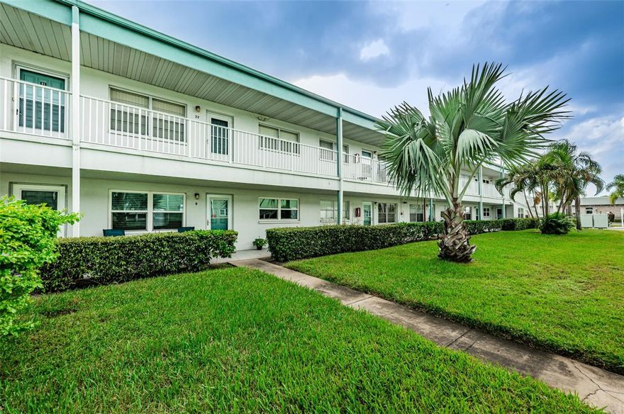 WOW ..... GROUND FLOOR .... Pretty as a Picture .... Maintained with Love .... 2-Bedroom Condo in Popular Paradise Shores...! From the moment you open the front door.... you know you are Home...! Inviting spacious living and dining areas, perfect for entertaining all of your guests with custom tile flooring thru-out, neutral colors, remodeled bathroom, tile, impact windows, and newer front & rear doors. The galley kitchen offers plenty cabinets, counter top space and a large pantry... just perfect for any Chef. The Floridaroom or Familyroom or Den or Office is peaceful and private and offers an Extra large storage closet can hold all of your belongings. Your covered carport is right outside your back door .... perfect for bringing all of your shopping bags home. The oversized Master Bedroom can accommodate all of your furniture and offers a full wall to wall closet. The beautifully remodeled bathroom offers walk in shower, with custom tile accents, updated vanity and lighting. The large 2nd bedroom is perfect for all of your guests with large closet and a view of the courtyard. Watchout.... they may not want to leave. The bathroom was updated with a walk-in shower, gorgeous tilework, and new cabinet and fixtures. AC unit installed approximately 2017. Enjoy the peaceful courtyard from you front porch while having your morning coffee. The monthly HOA fee includes Internet, WiFi, Cable TV, Gas for cooking and eat and hot water, building exterior, reserves, building insurance, grounds maintenance, recreational facilities, roof, trash, sewer and water. Paradise Shores is known for it's many amenities and superb location. Community Center with a library, a heated swimming pool, shuffle board and a bocce court. Whether a seasonal resident or a full time resident, this affordable condo is Home! Sorry, unfortunately pets are prohibited, only registered service animals. Minutes to the Beaches, Downtown St. Petersburg with the new Pier, and easy commute to Tampa International Airport. And ....the Publix Grocery Store is just across the street. Minutes to additional shopping and the Tyrone Mall. Whether this is your fulltime Home or your second vacation Home.... Welcome HOME...! Don't wait....Call today for your personal viewing or a FaceTime Real-Time Tour....!