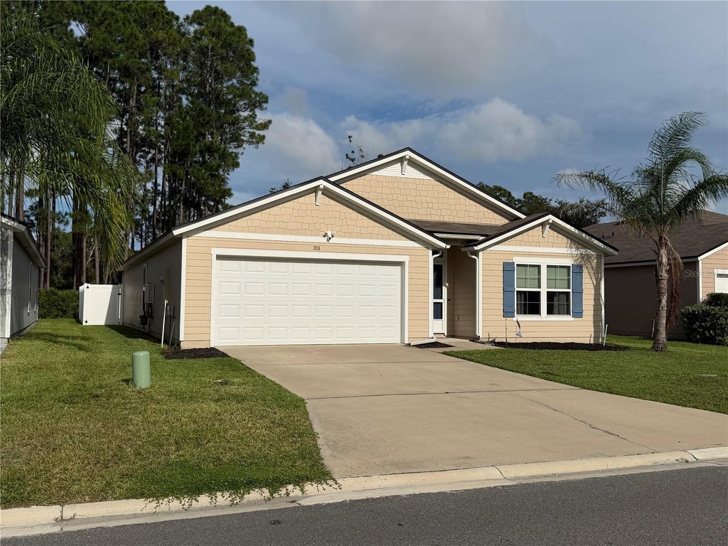 Photo of 703 Grand Reserve Drive, Bunnell, FL 32110 (MLS # O6437750)